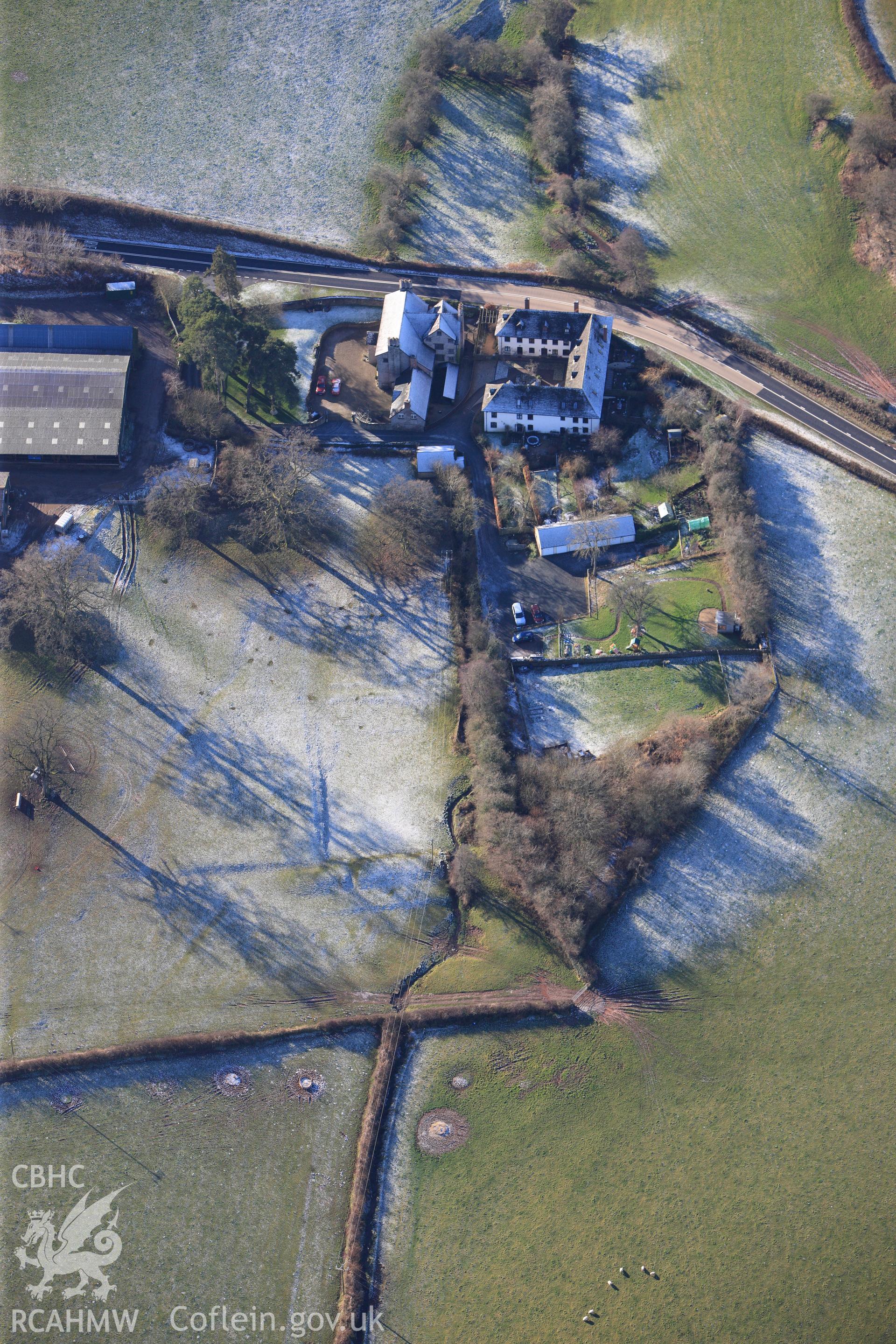 Trebarries mansion with its associated gardens and stable block, north west of Talgarth, Breconshire. Oblique aerial photograph taken during the Royal Commission?s programme of archaeological aerial reconnaissance by Toby Driver on 15th January 2013.