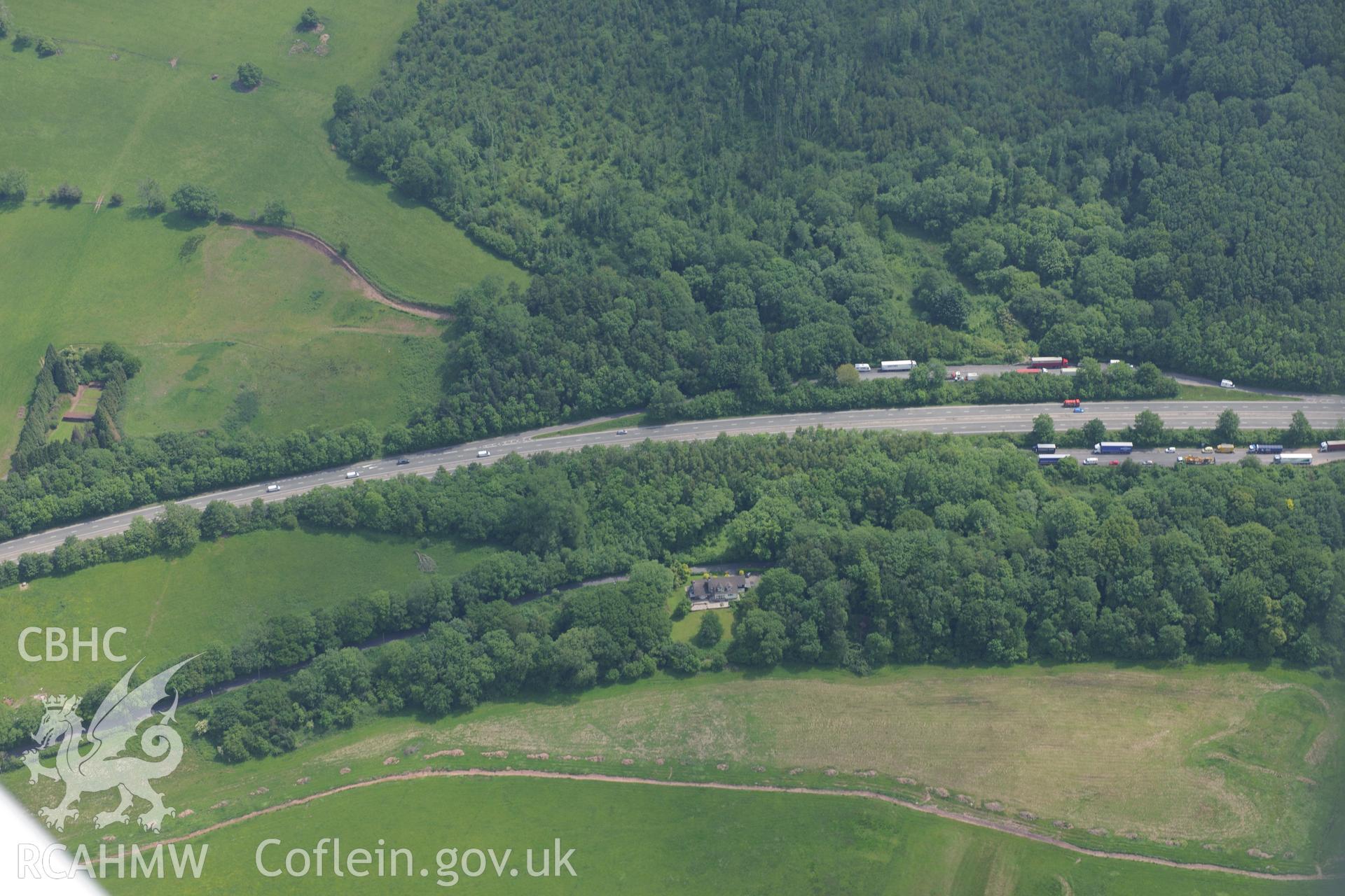 Pwll Bach, near Kemey Inferior Motte and Bailey. Oblique aerial photograph taken during the Royal Commission's programme of archaeological aerial reconnaissance by Toby Driver on 11th June 2015.