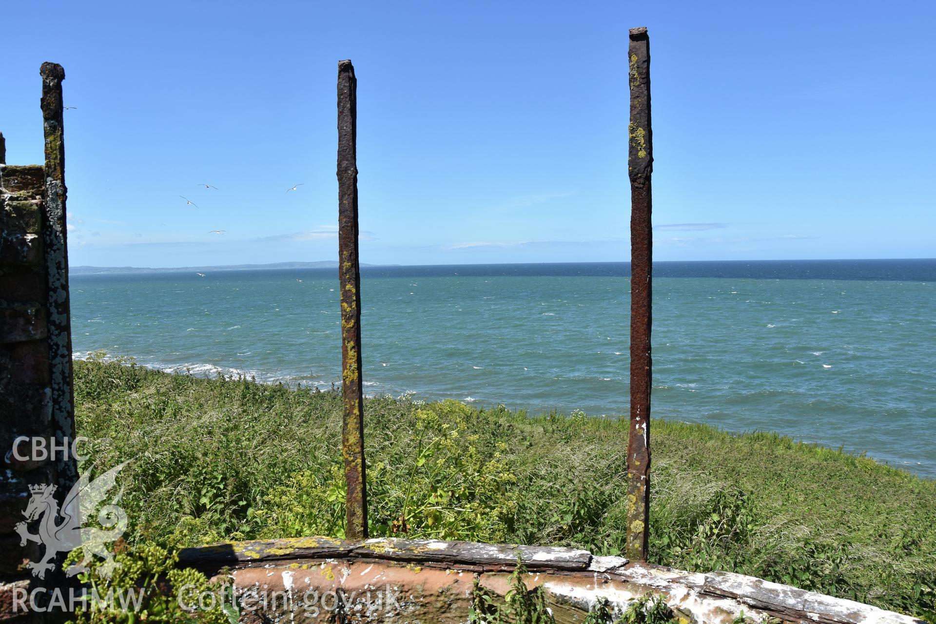 Investigator's photographic survey of the Telegraph Station on Puffin Island or Ynys Seiriol for the CHERISH Project. View of remains of panoramic observation window. ? Crown: CHERISH PROJECT 2018. Produced with EU funds through the Ireland Wales Co-operation Programme 2014-2020. All material made freely available through the Open Government Licence.