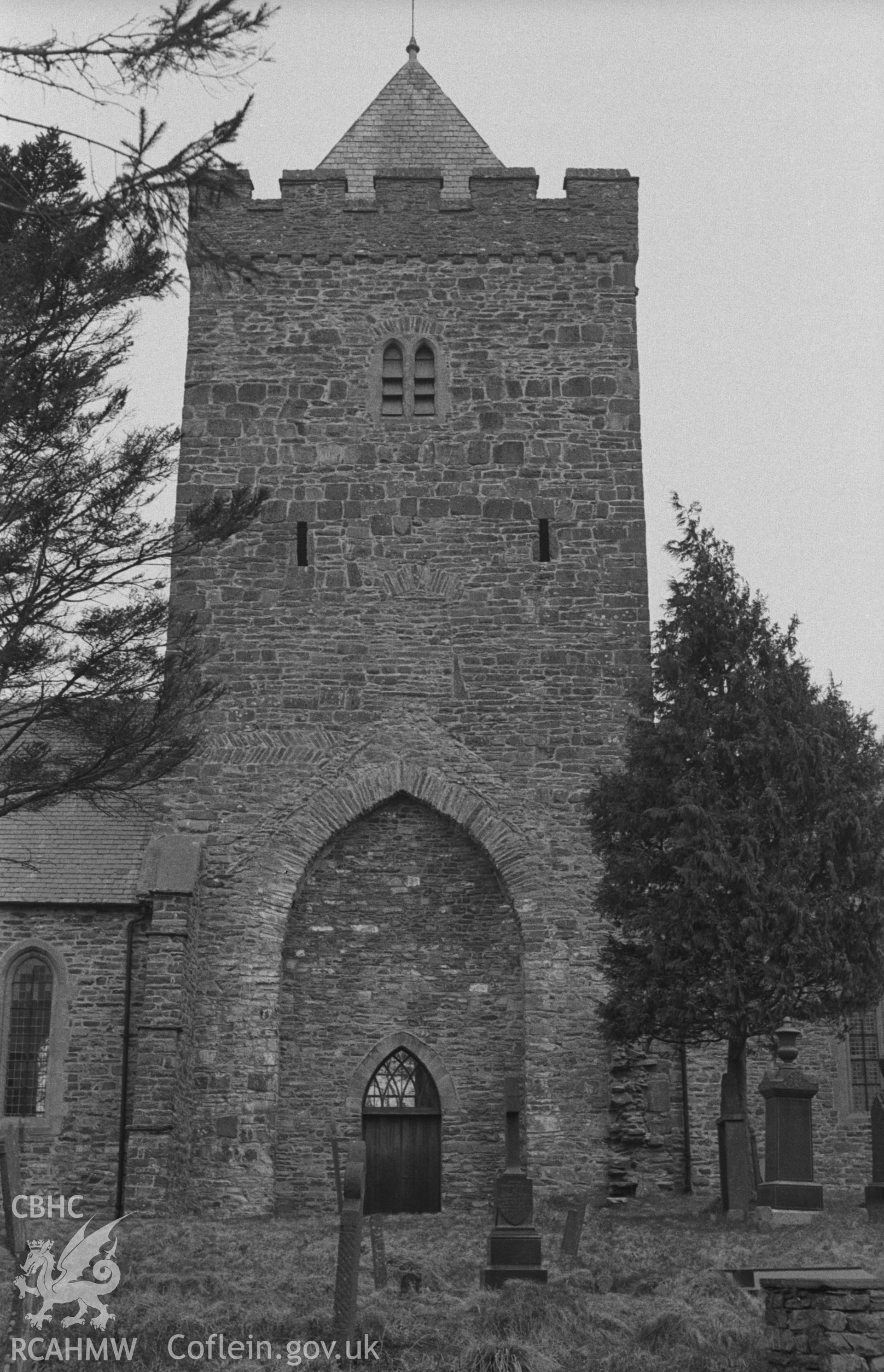 Digital copy of black & white negative showing the church tower from south, showing arch of demolished south transept at St. David's Church, Llanddewi Brefi. Photographed in April 1963 by Arthur O. Chater from Grid Reference SN 6637 5527, looking north.