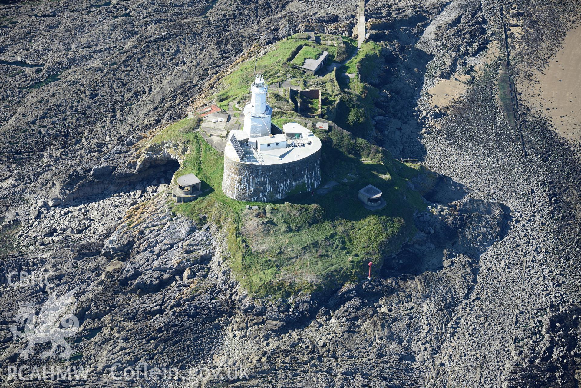 Mumbles fort, coast artillery searchlights and Mumbles lighthouse on south western edge of Swansea Bay. Oblique aerial photograph taken during the Royal Commission's programme of archaeological aerial reconnaissance by Toby Driver, 30th September 2015.