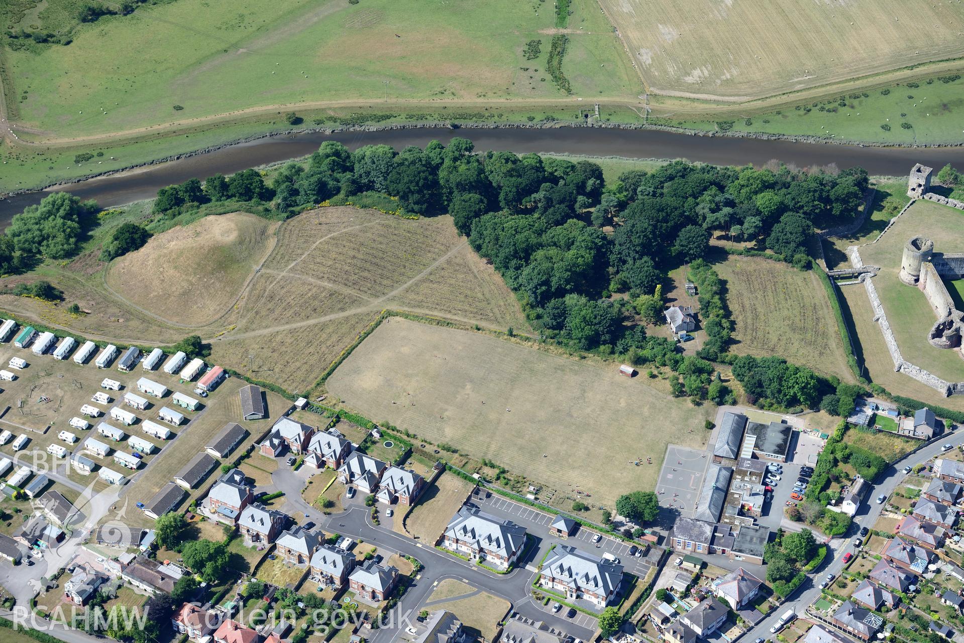 Royal Commission aerial photography of Twt Hill, with parchmarks showing traces of a masonry tower on the summit of the motte, taken on 19th July 2018 during the 2018 drought.