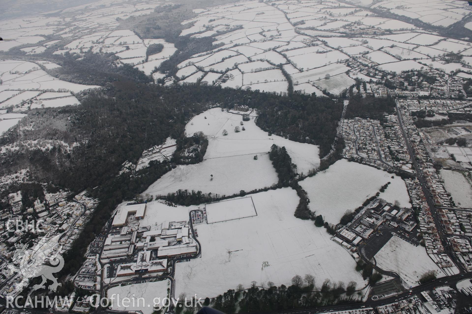 Ysgol Gyfun y Strade, Coleg Sir Gar (Graig Campus) and Stradey Castle Garden, Llanelli. Oblique aerial photograph taken during the Royal Commission?s programme of archaeological aerial reconnaissance by Toby Driver on 24th January 2013.