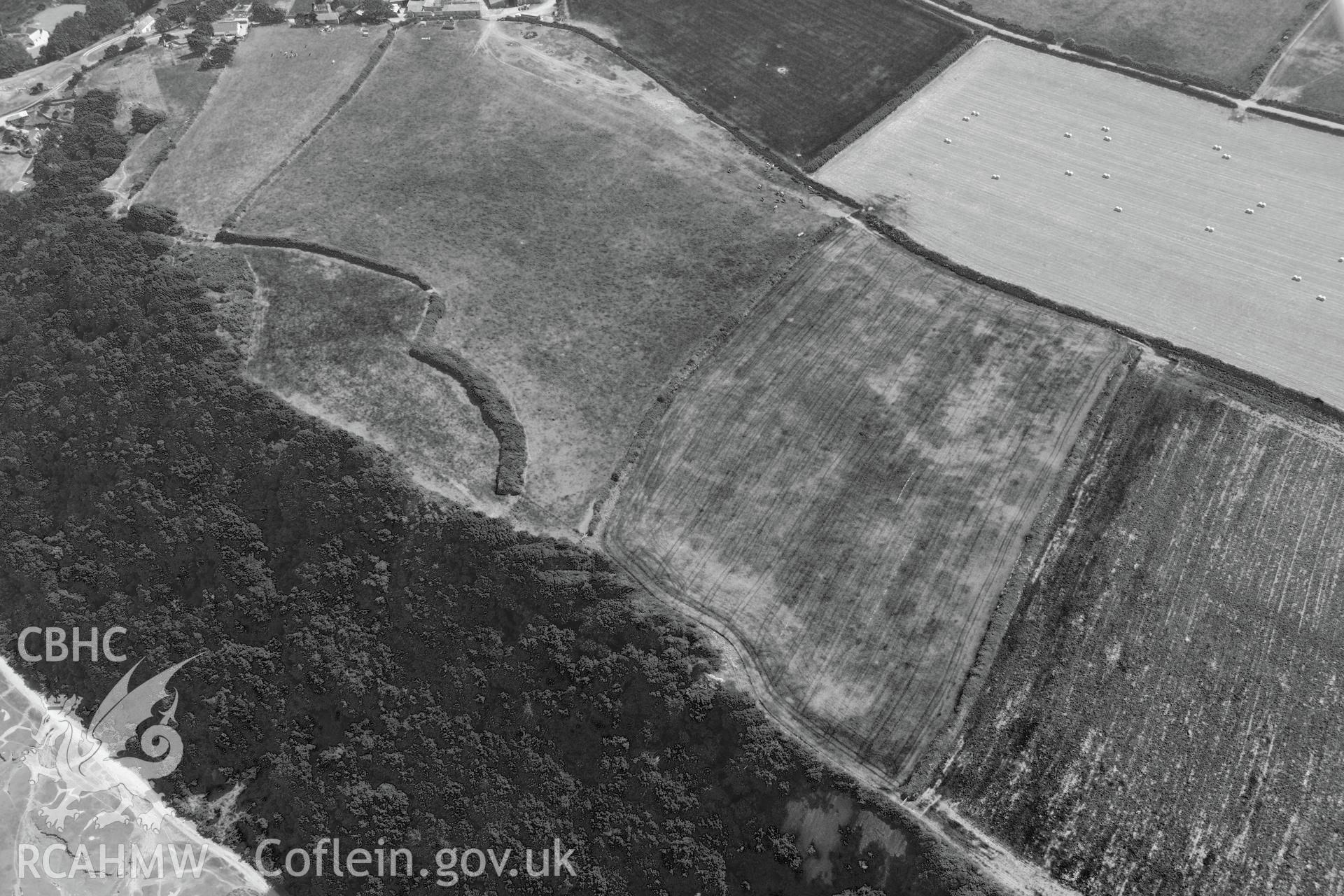 Bovehill Farm defended enclosure and Tor-Gro suggested enclosure, east of Cheriton, on the Gower Peninsula. Oblique aerial photograph taken during the Royal Commission?s programme of archaeological aerial reconnaissance by Toby Driver on 16th July 2013.