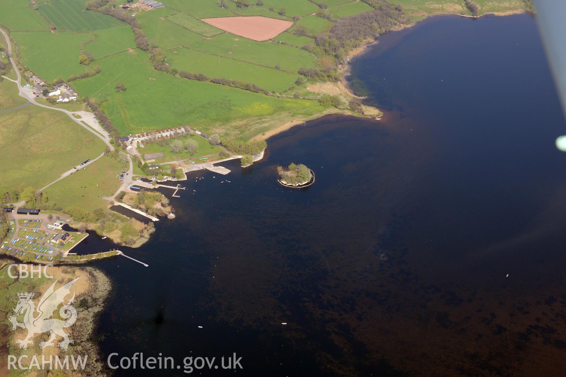 The Welsh Crannog Centre, Llangors Lake and Llangors, Crannog. Oblique aerial photograph taken during the Royal Commission's programme of archaeological aerial reconnaissance by Toby Driver on 21st April 2015