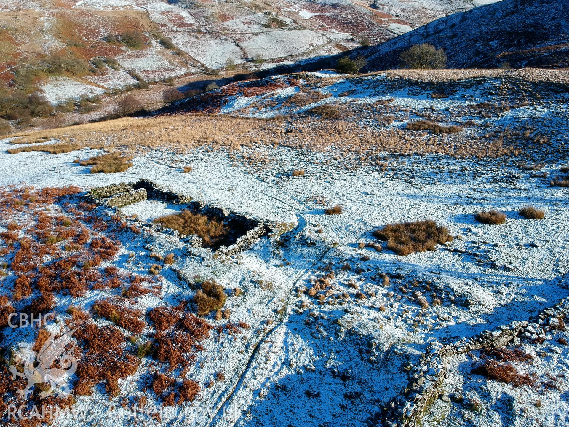 Aerial view showing remains of deserted, dry-stone walled Hafod Eidos rural settlement, Cwm Mwyro. Colour photograph taken by Paul R. Davis on 17th January 2019.