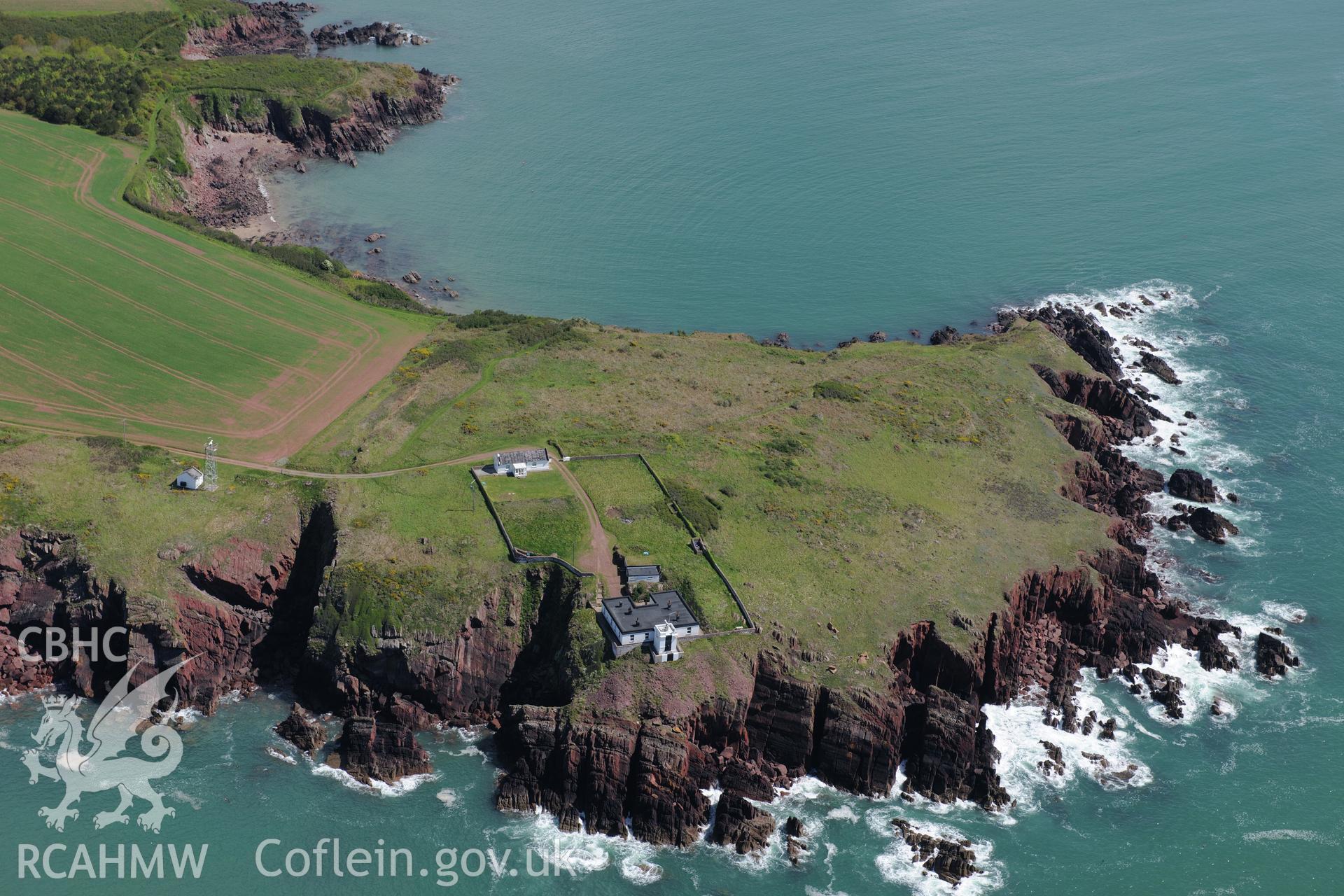 Great Castle Head promontory fort and Leading Lights, a summer house near St. Ishmaels. Oblique aerial photograph taken during the Royal Commission's programme of archaeological aerial reconnaissance by Toby Driver on 13th May 2015.