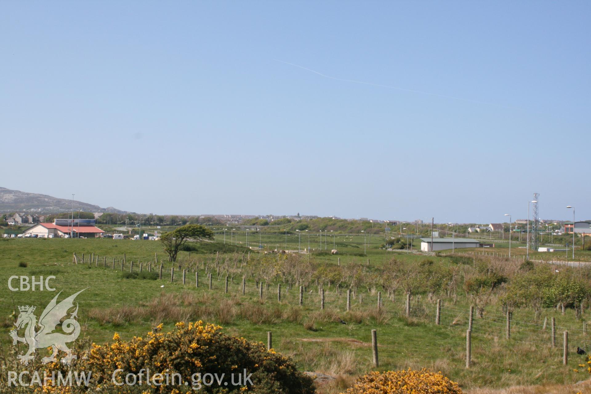 View looking northwest towards the development site from Trefignath Chambered Tomb. Digital photograph taken as part of archaeological work at Parc Cybi Enterprise Zone, Holyhead, Anglesey, carried out by Archaeology Wales, 2017. Project number: P2522.