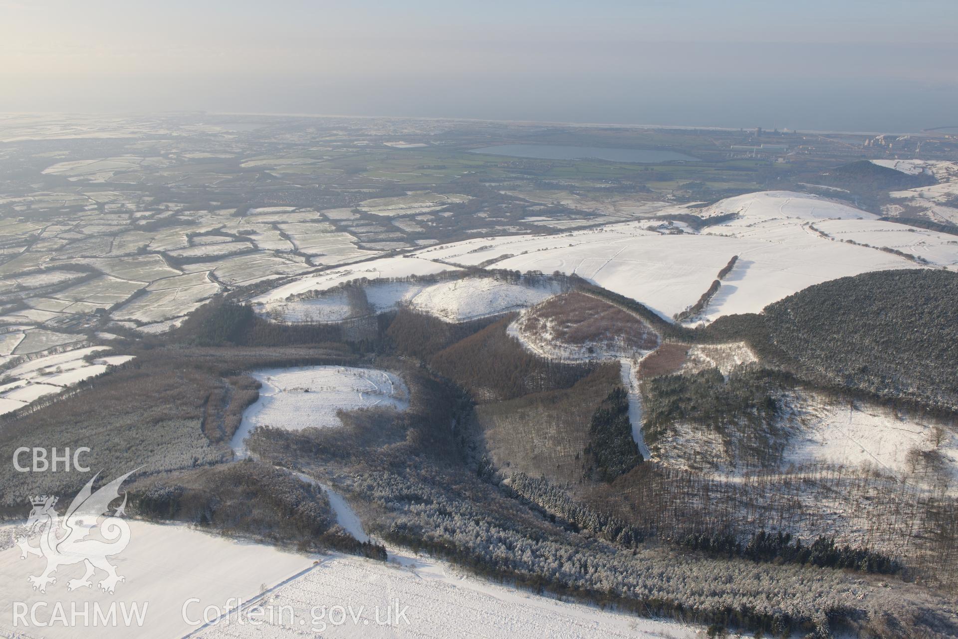 Eglwys Nunydd reservoir and Ton Mawr enclosure, east of Margam, Port Talbot. Oblique aerial photograph taken during the Royal Commission?s programme of archaeological aerial reconnaissance by Toby Driver on 24th January 2013.