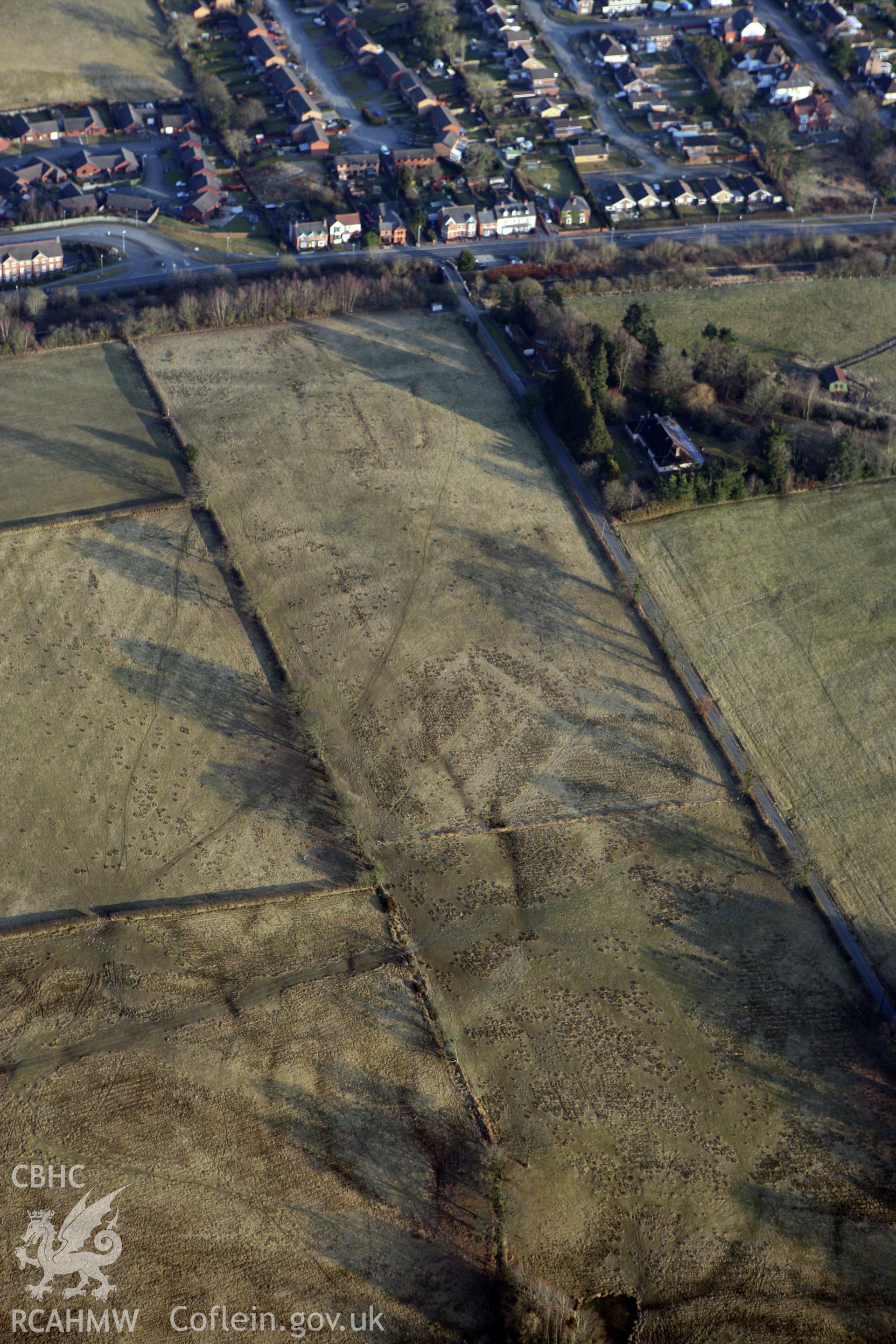 RCAHMW colour oblique photograph of Llandrindod Common Roman Practice Camps and Roman Road. Taken by Toby Driver on 11/03/2010.