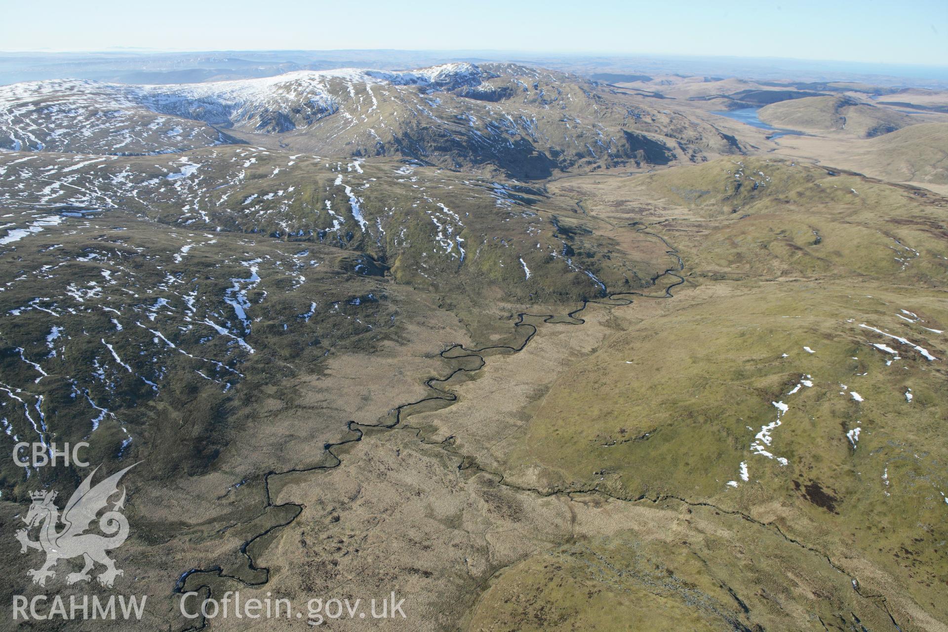 RCAHMW colour oblique photograph of Hut Circle settlement below Foel Isaf, Bugeilyn. Taken by Toby Driver on 08/03/2010.