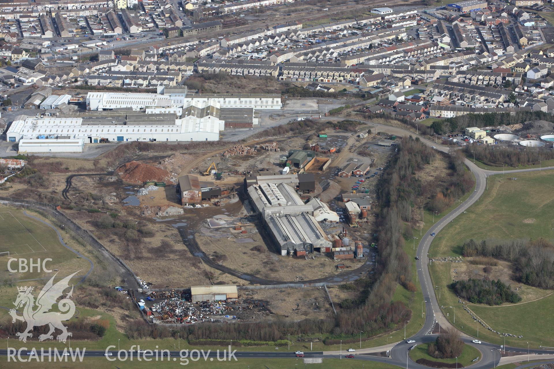 RCAHMW colour oblique photograph of Nevill's Dock;Copperworks Dock;Copperhouse Dock, Llanelli. Taken by Toby Driver on 02/03/2010.