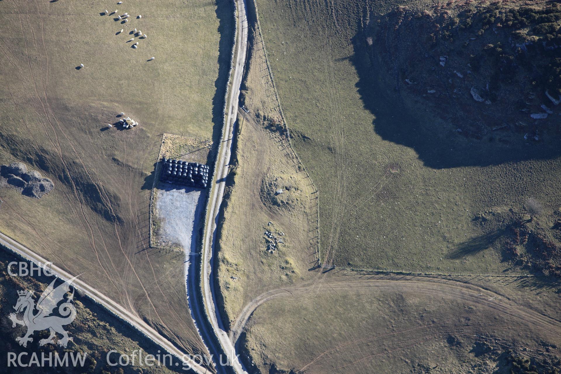 RCAHMW colour oblique photograph of Bedd Taliesin round barrow. Taken by Toby Driver on 08/03/2010.