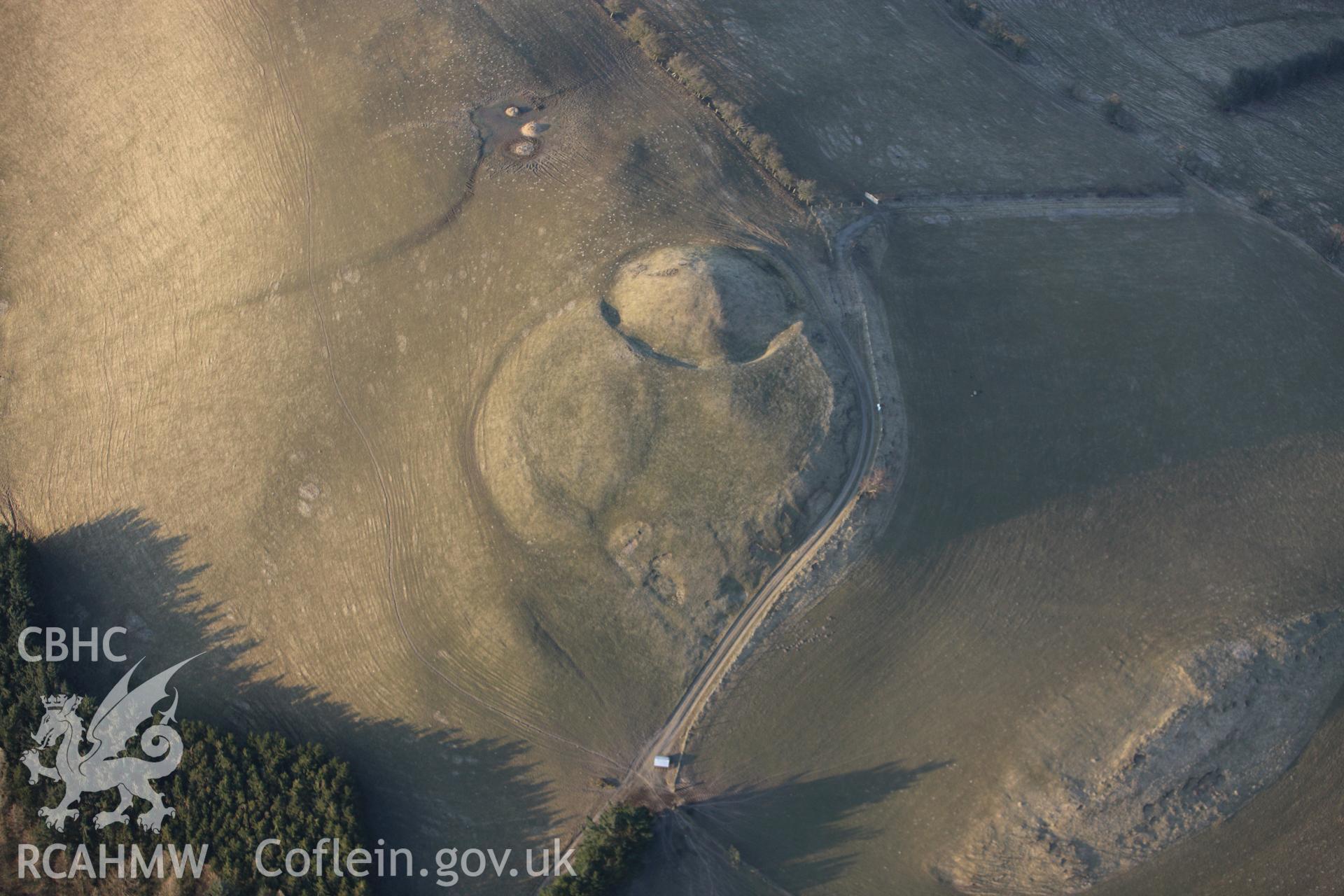 RCAHMW colour oblique photograph of Tomen Bedd-Ugre Motte and Bailey. Taken by Toby Driver on 11/03/2010.