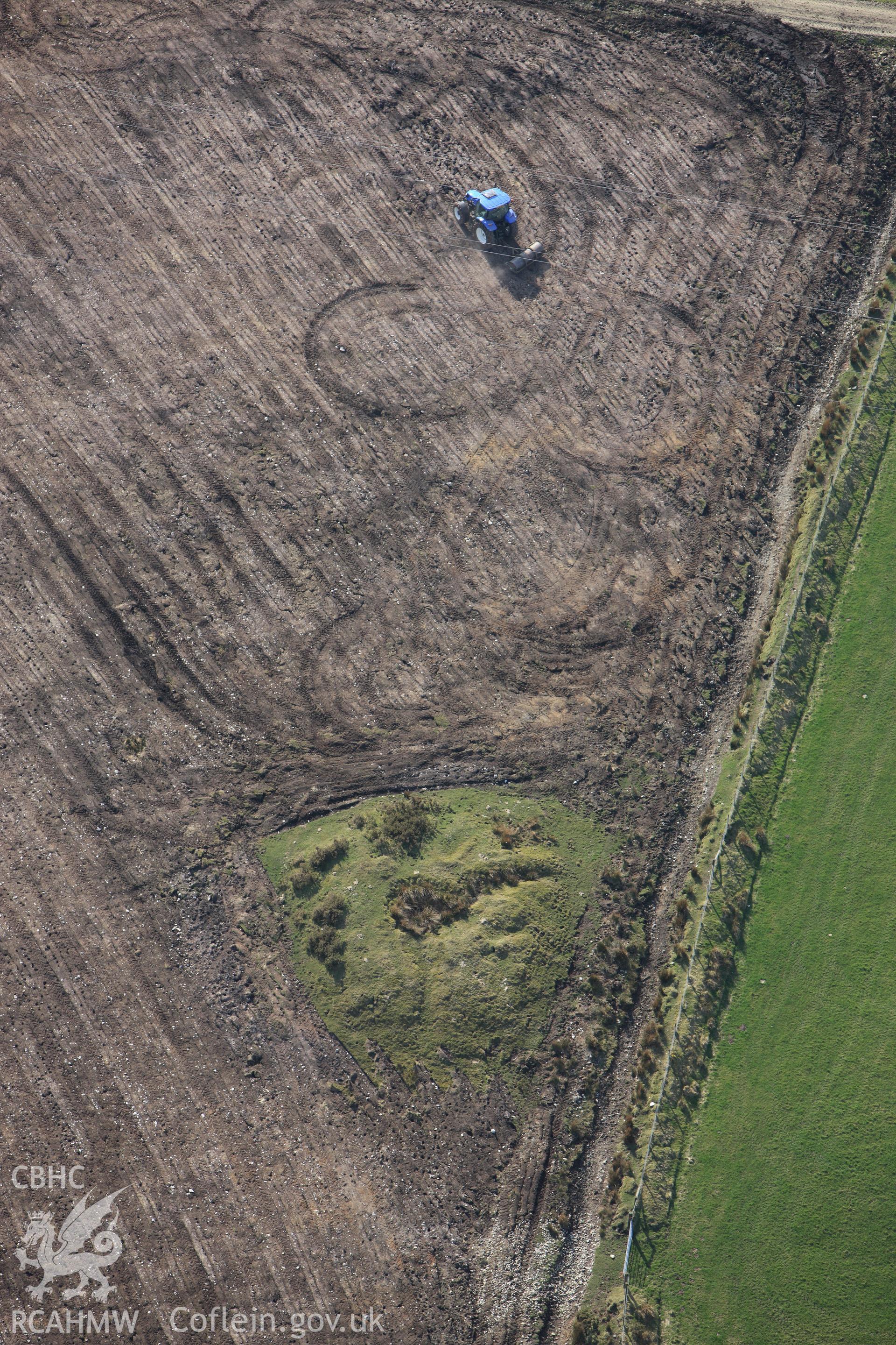 RCAHMW colour oblique aerial photograph of Cructarw with ploughing. Taken on 13 April 2010 by Toby Driver