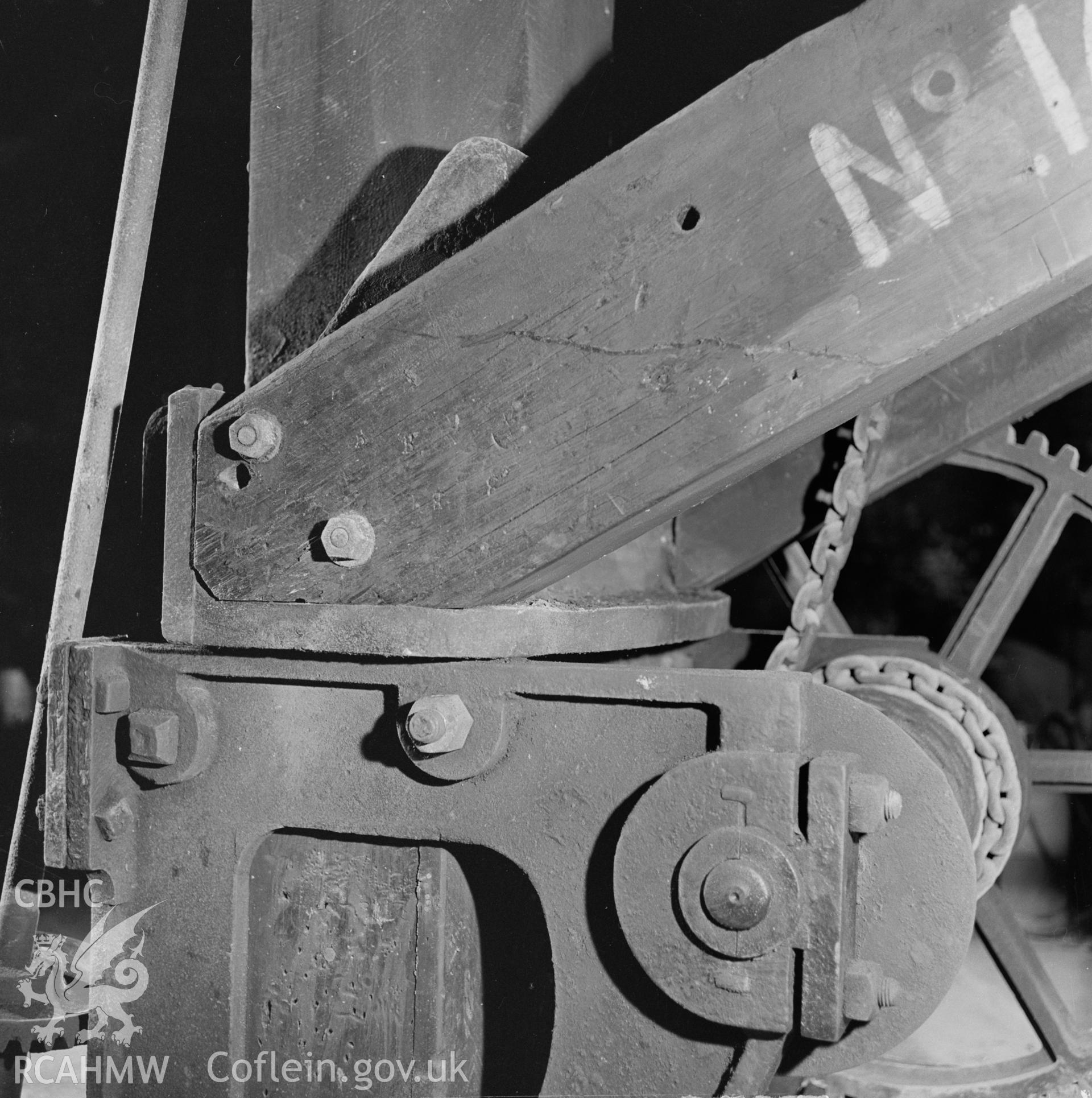 Digital copy of a black and white negative showing detail of the crane at Player's Works Foundry, Clydach, taken by RCAHMW, undated.