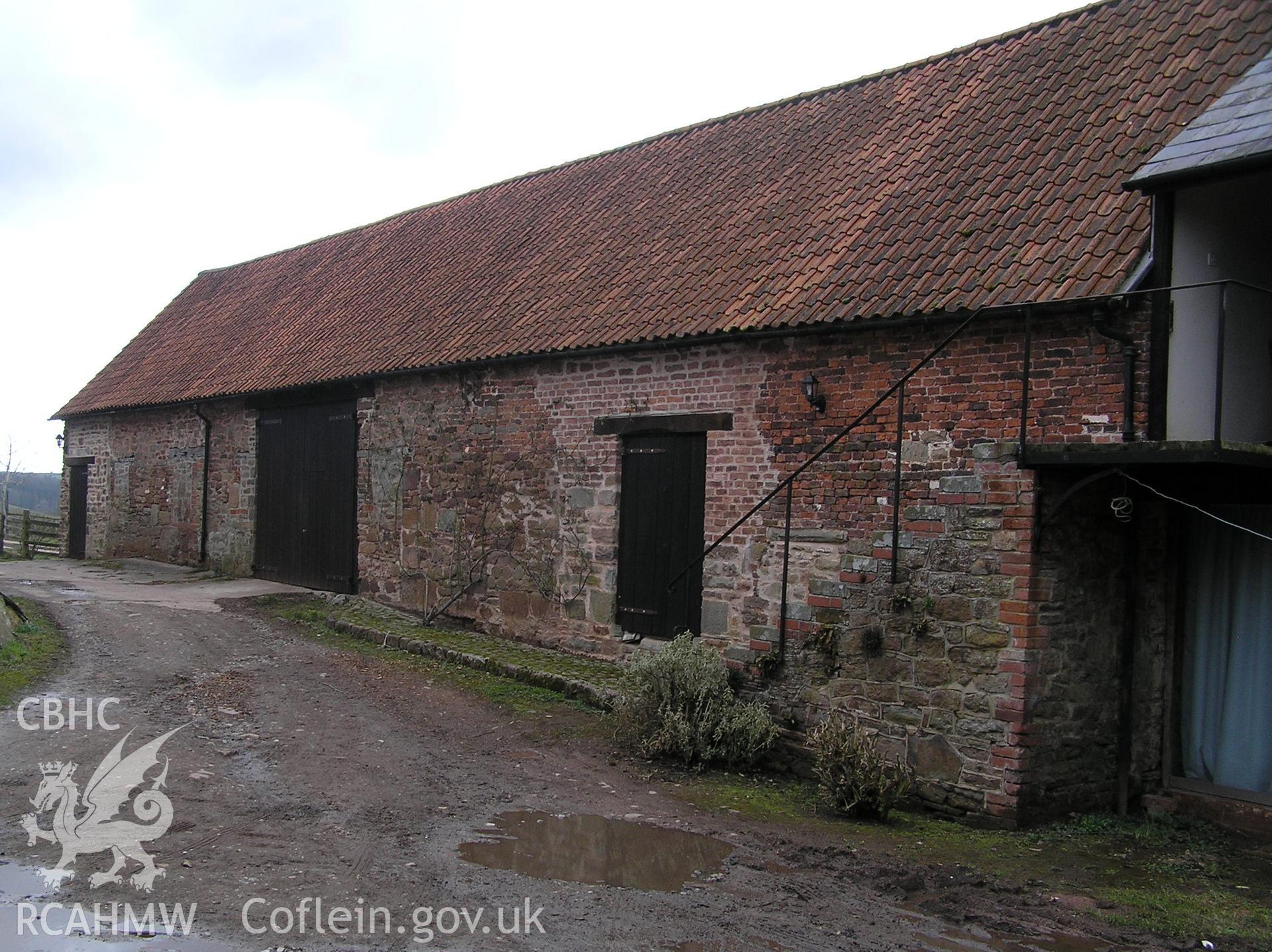 Colour photo showing east elevation of the cowhouse from the north, taken by John Wheelock and donated as a condition of planning consent.