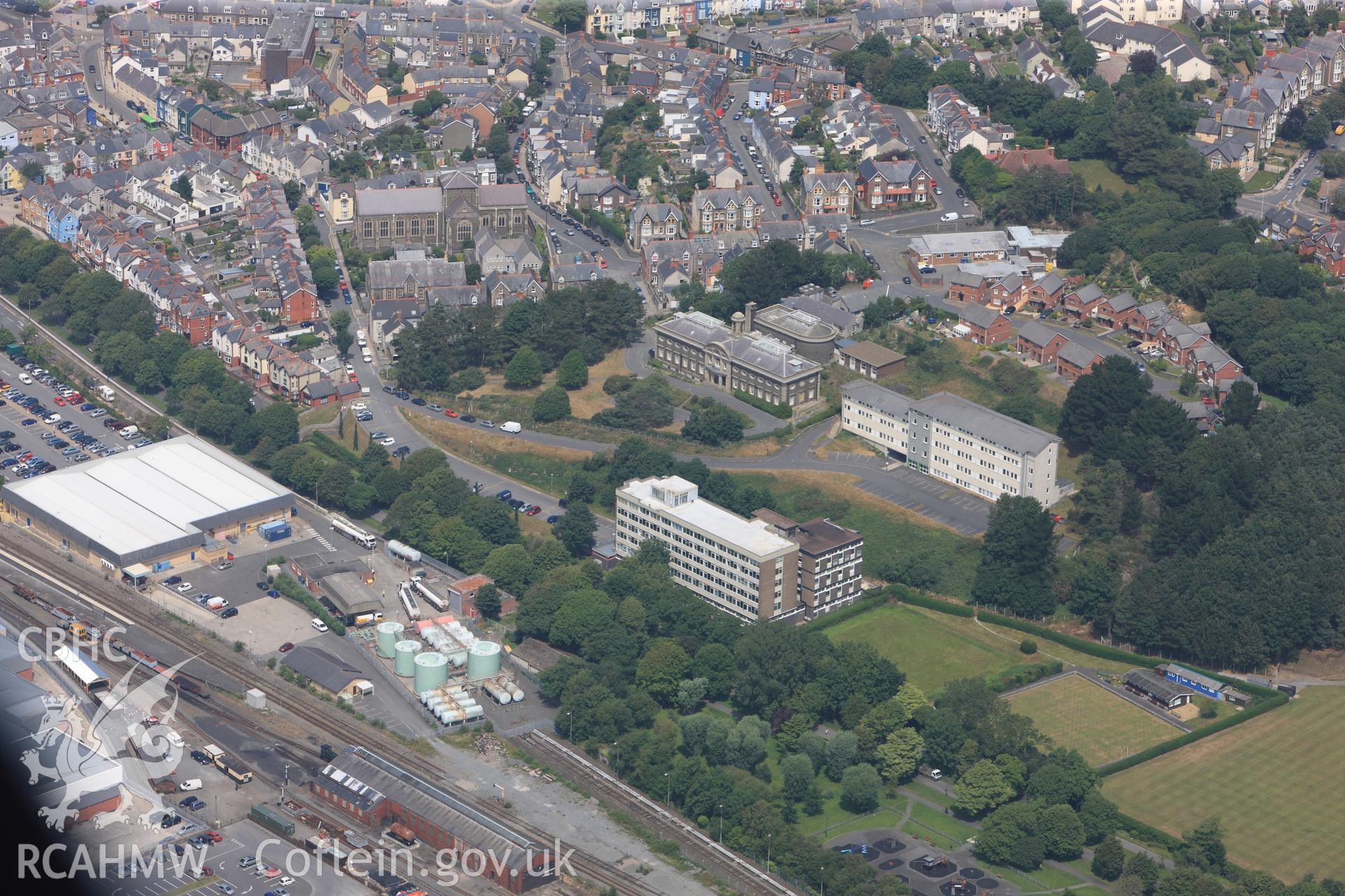 View of Aberystwyth including Holy Trinity Church, Plas Crug Avenue, the School of Art building and the Crown Building. Oblique aerial photograph taken during RCAHMW?s programme of archaeological aerial reconnaissance by Toby Driver on 12th July 2013.
