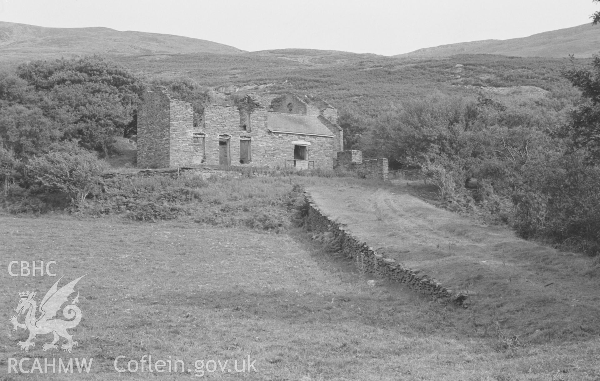 Digital copy of black & white negative showing mine office building at Bryndyfi Lead Mine, Eglwysfach, Machynlleth. Embankment of road to the mine seen on right. Photographed by Arthur O. Chater in August 1966, looking east from Grid Reference SN 682 934.