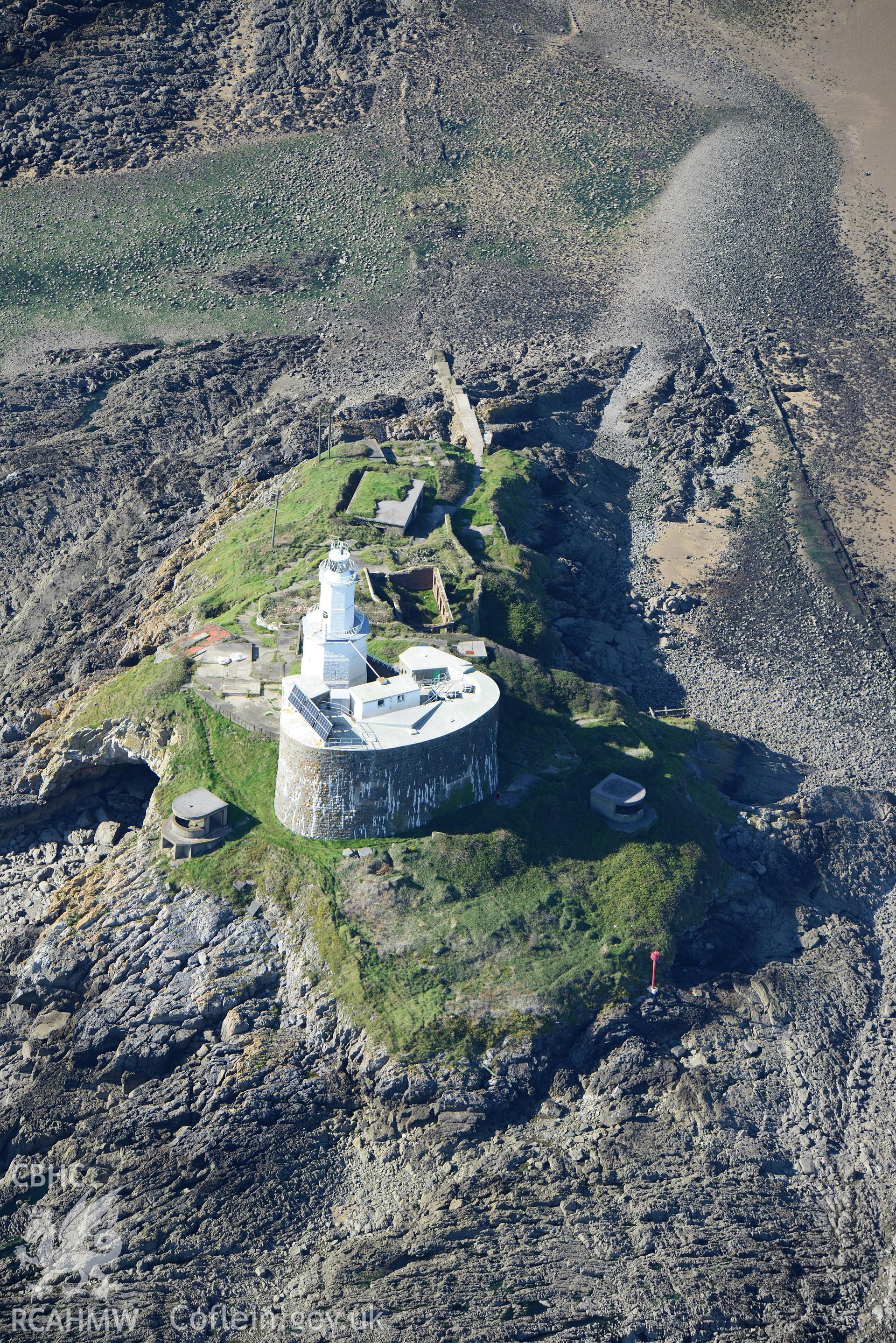 Mumbles fort, coast artillery searchlights and Mumbles lighthouse on south western edge of Swansea Bay. Oblique aerial photograph taken during the Royal Commission's programme of archaeological aerial reconnaissance by Toby Driver, 30th September 2015.