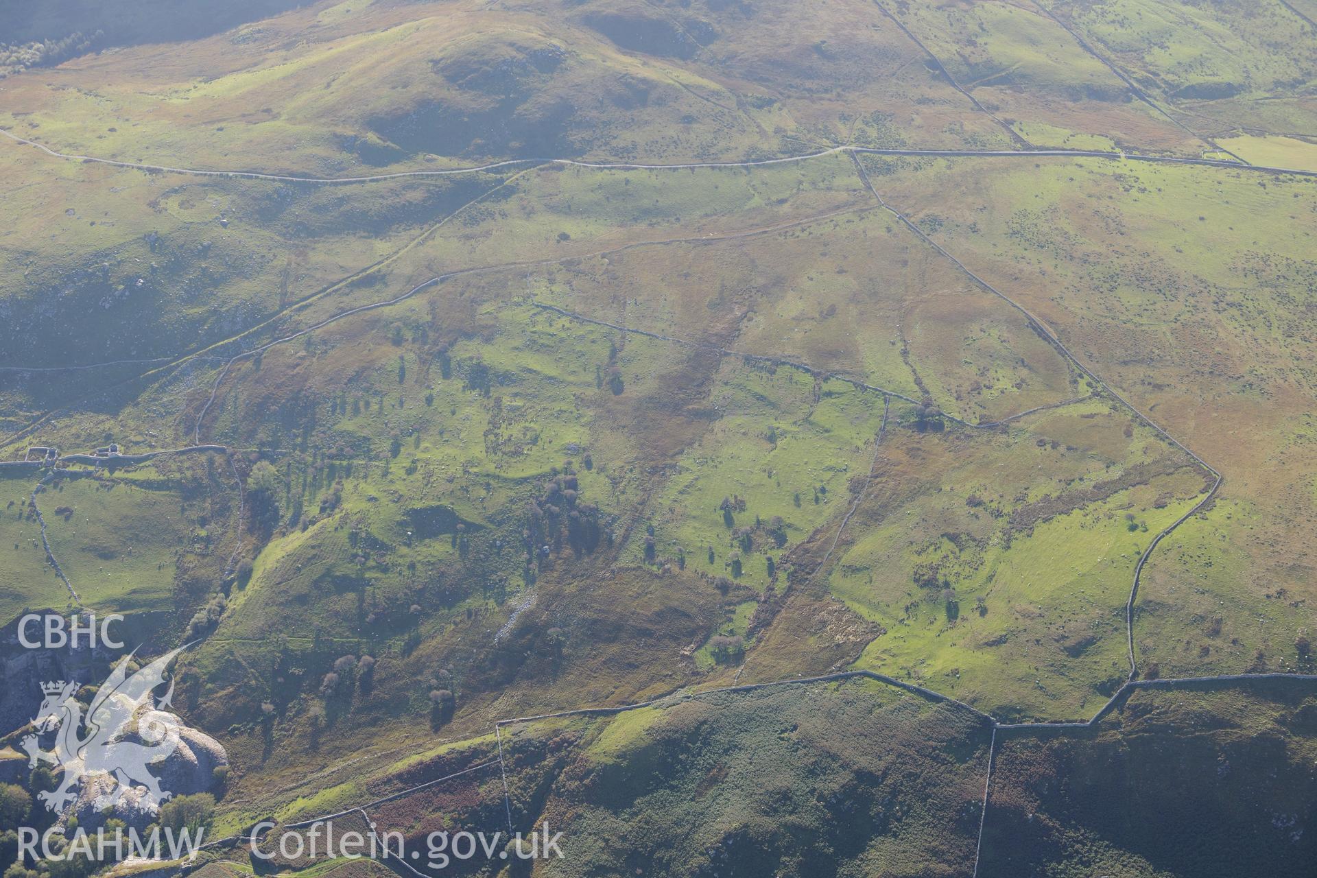 Goleuwern slate quarry, Hen-ddol slate quarry and hut circles south east of Mynydd Craig Wen, near Fairbourne. Oblique aerial photograph taken during the Royal Commission's programme of archaeological aerial reconnaissance by Toby Driver on 2nd October 2015.