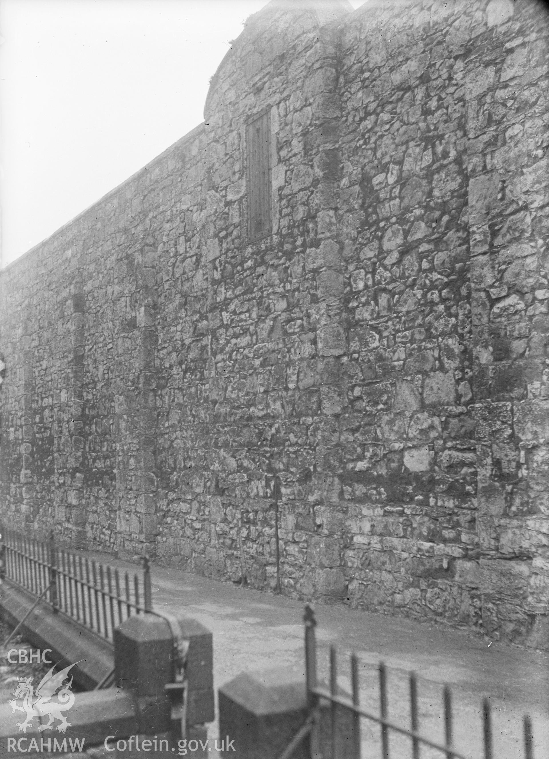 Digital copy of a nitrate negative showing exterior wall of Beaumaris Gaol. From the Cadw Monuments in Care Collection.