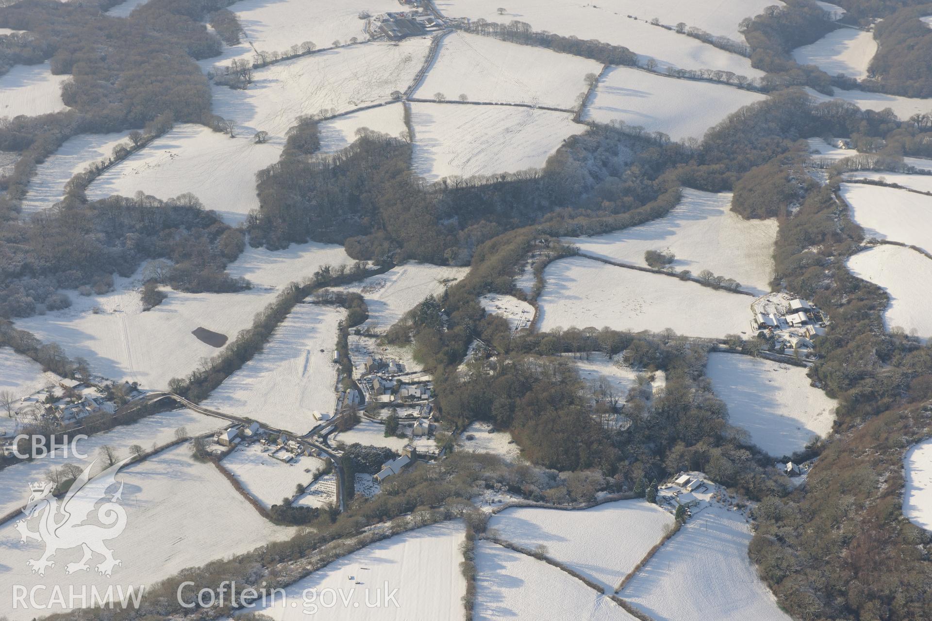 Nevern castle and the surrounding town, between Cardigan and Fishguard. Oblique aerial photograph taken during the Royal Commission?s programme of archaeological aerial reconnaissance by Toby Driver on 24th January 2013.