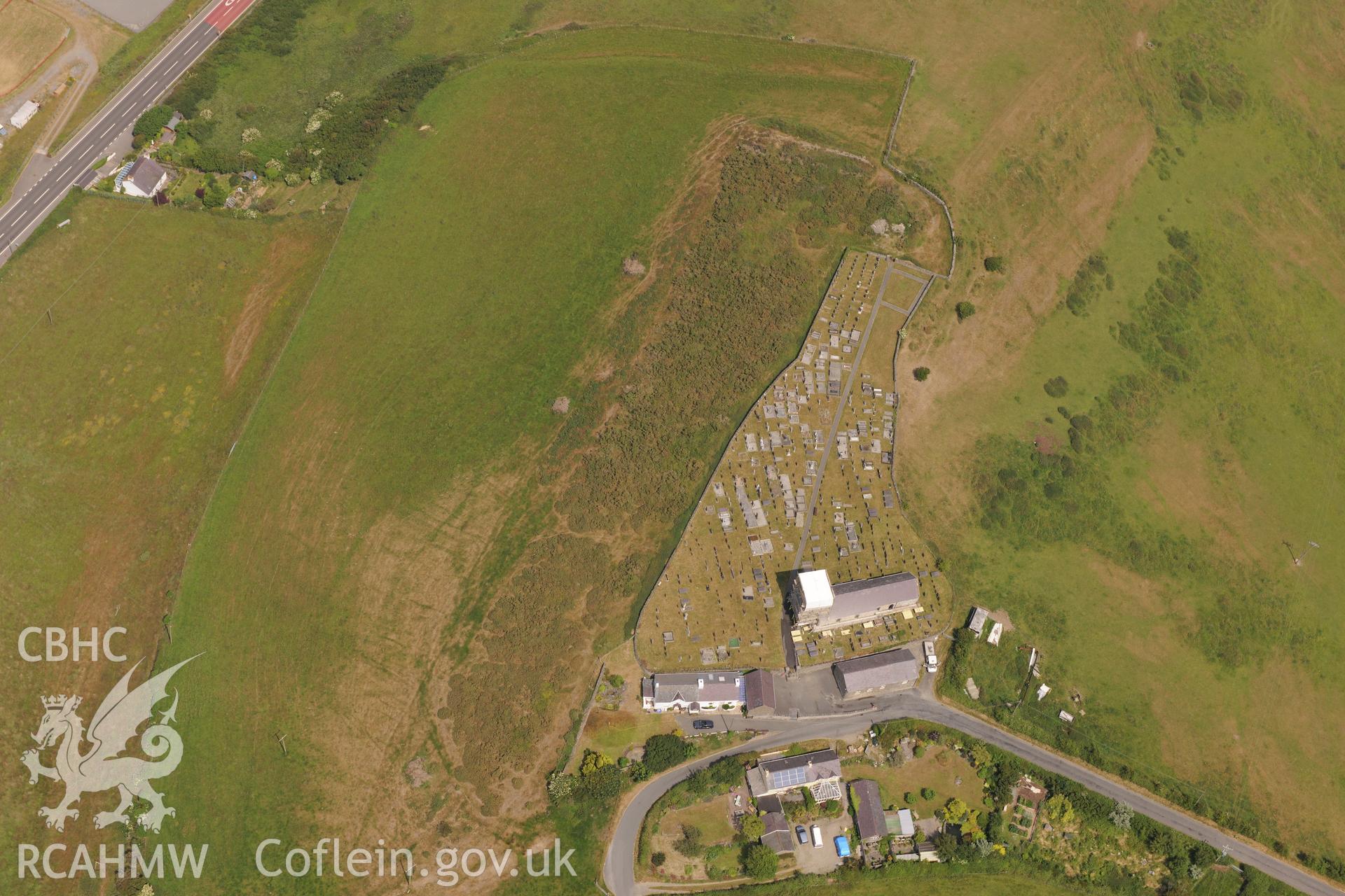 Hillfort, St David's Church, and Sunday School at Llanddewi Aberarth, south west of Aberystwyth. Oblique aerial photograph taken during the Royal Commission?s programme of archaeological aerial reconnaissance by Toby Driver on  12th July 2013.