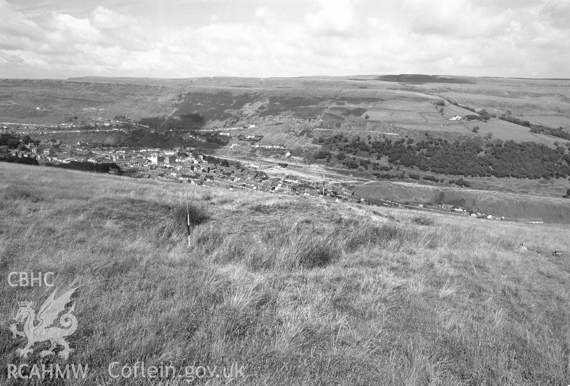 Digital copy of a black and white negative showing view of platform house, medieval earthworks in Ferndale.