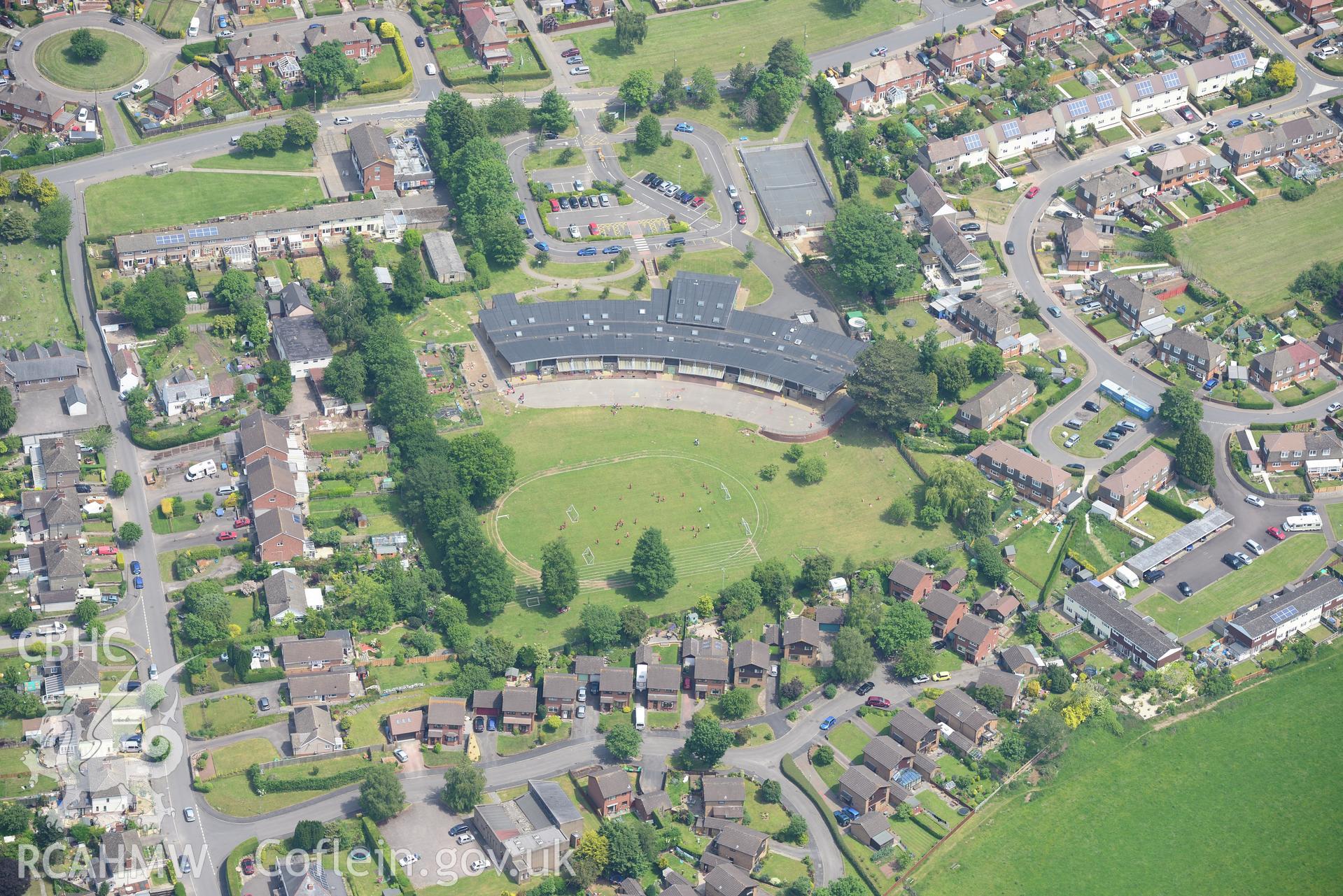 Kymin View Primary and Nursery School and Monmouth suburbs. Oblique aerial photograph taken during the Royal Commission's programme of archaeological aerial reconnaissance by Toby Driver on 11th June 2015.