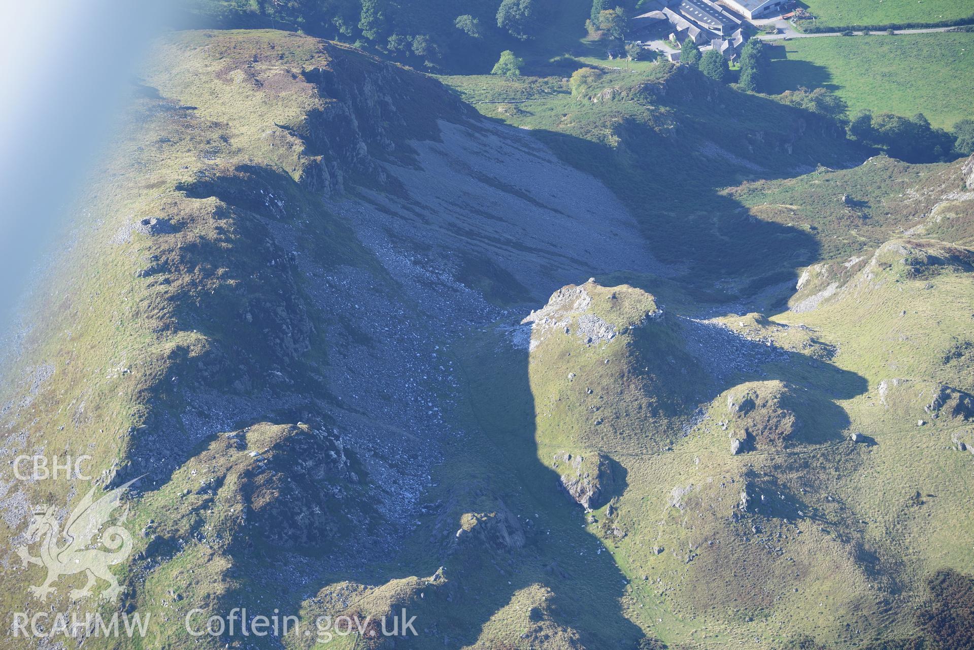 Craig yr Aderyn cairn, and a crag to its east, near Abergynolwyn. Oblique aerial photograph taken during the Royal Commission's programme of archaeological aerial reconnaissance by Toby Driver on 2nd October 2015.