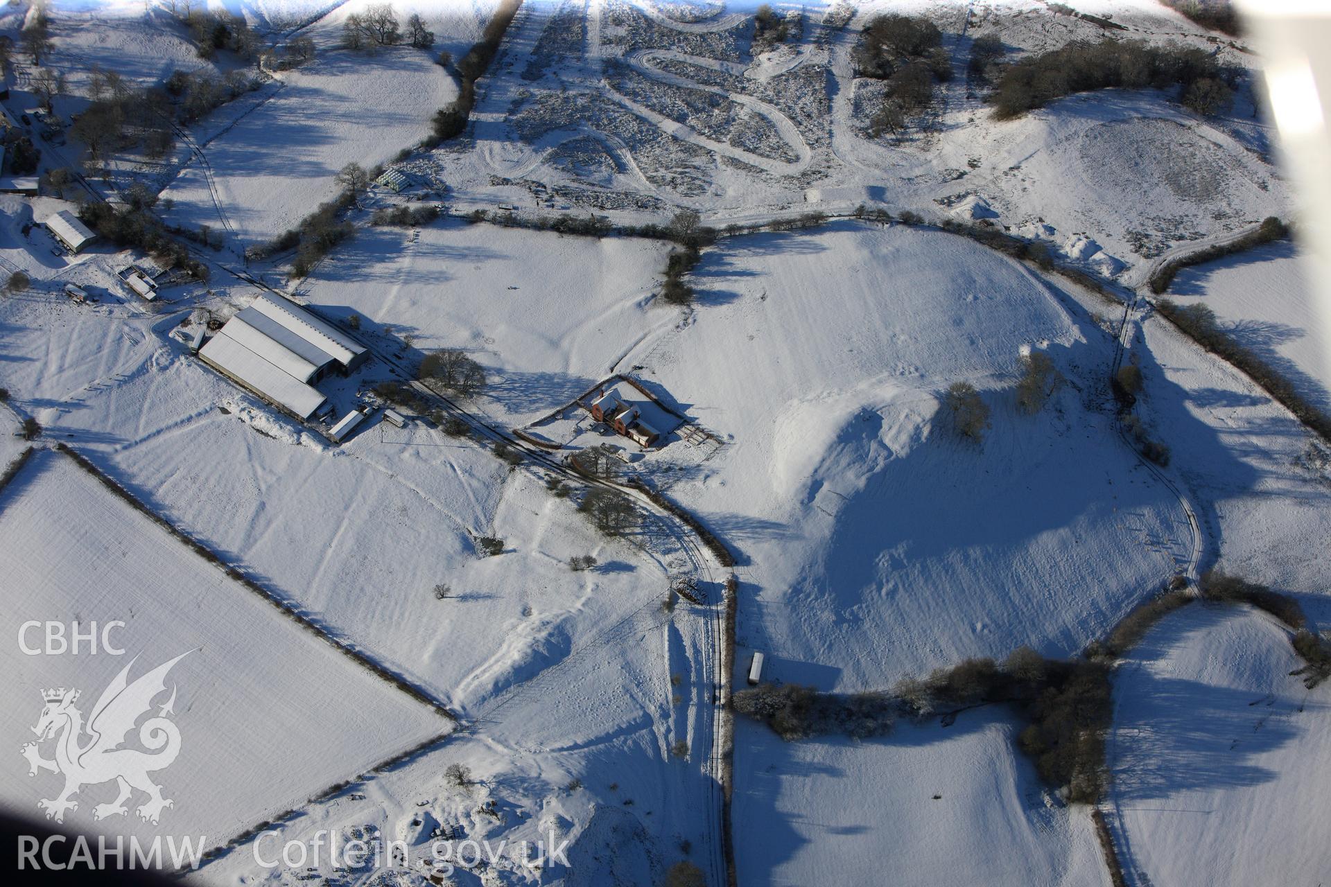 Earthworks of a longhouse and Cefnllys Castle deer park, Penybont, north east of Llandrindod Wells. Oblique aerial photograph taken during the Royal Commission?s programme of archaeological aerial reconnaissance by Toby Driver on 15th January 2013.