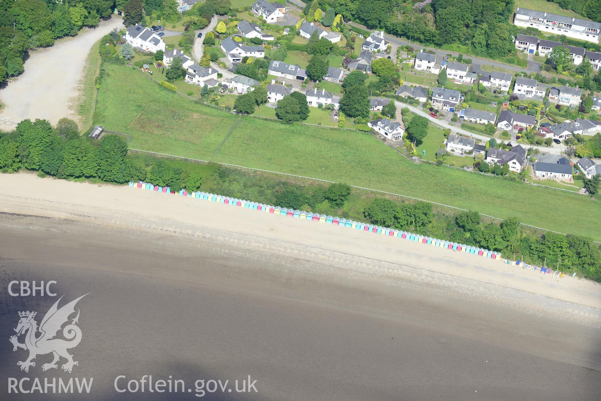 Beach huts on Llanbedrog beach. Oblique aerial photograph taken during the Royal Commission's programme of archaeological aerial reconnaissance by Toby Driver on 23rd June 2015.