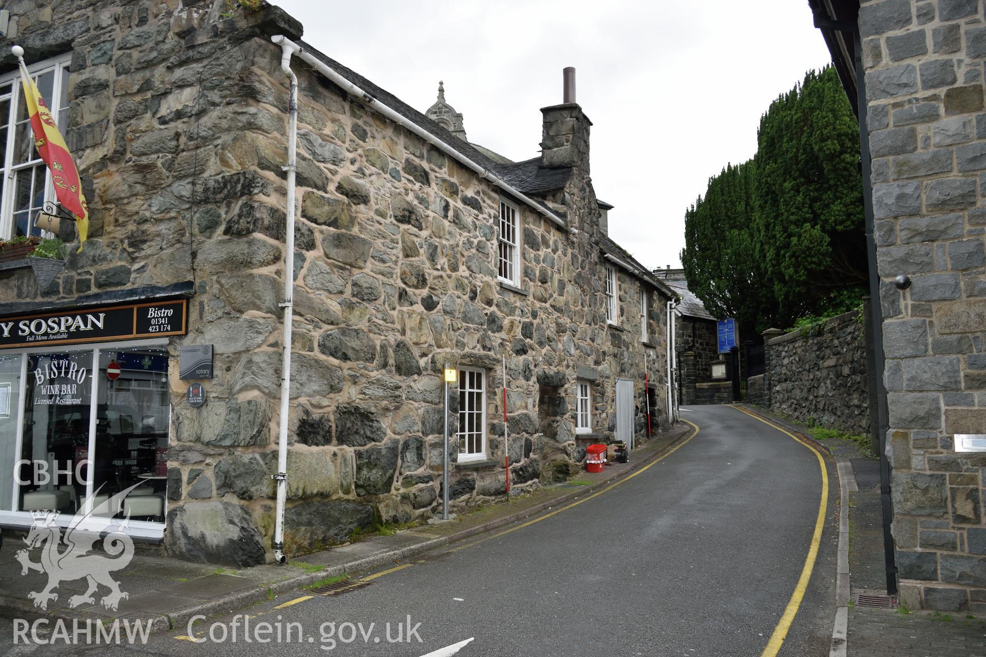 Colour photograph showing view looking south west at the south elevation of Y Sospan, Llys Owain, Dolgellau. Photographed by I. P. Brookes of Engineering Archaeological Services, June 2019.