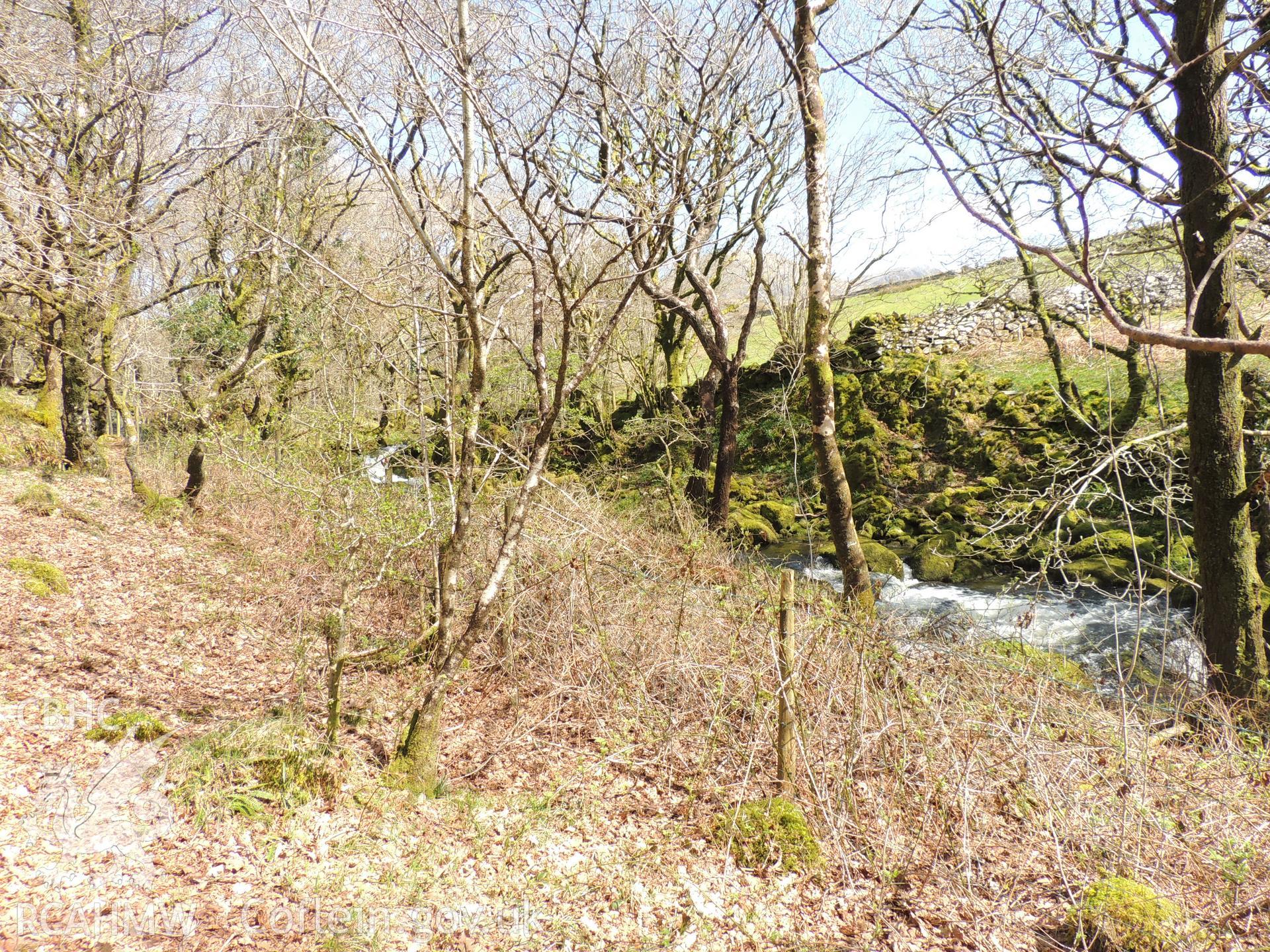 'View to intake location, demonstrating lack of visibility to heritage assets located in Croesor. Looking north east.' Photographed as part of heritage impact assessment of the Afon Croesor, on the Brondanw Estate. Produced by Archaeology Wales, 2018.