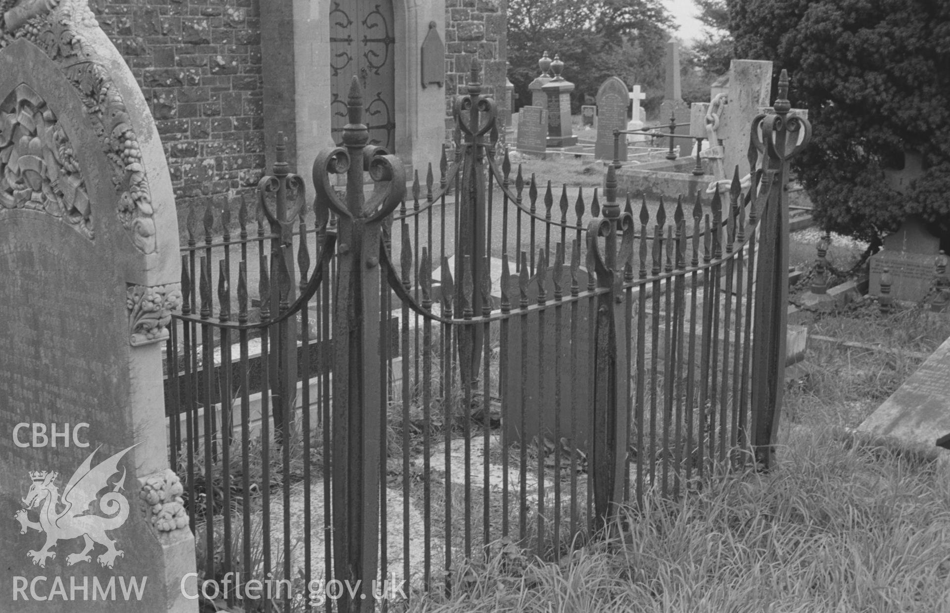 Digital copy of a black and white negative showing iron grave enclosure around grave of 1849 at St. David's Church, Henfynyw, Aberaeron. Photographed by Arthur O. Chater on 5th September 1966 from Grid Reference SN 447 613.