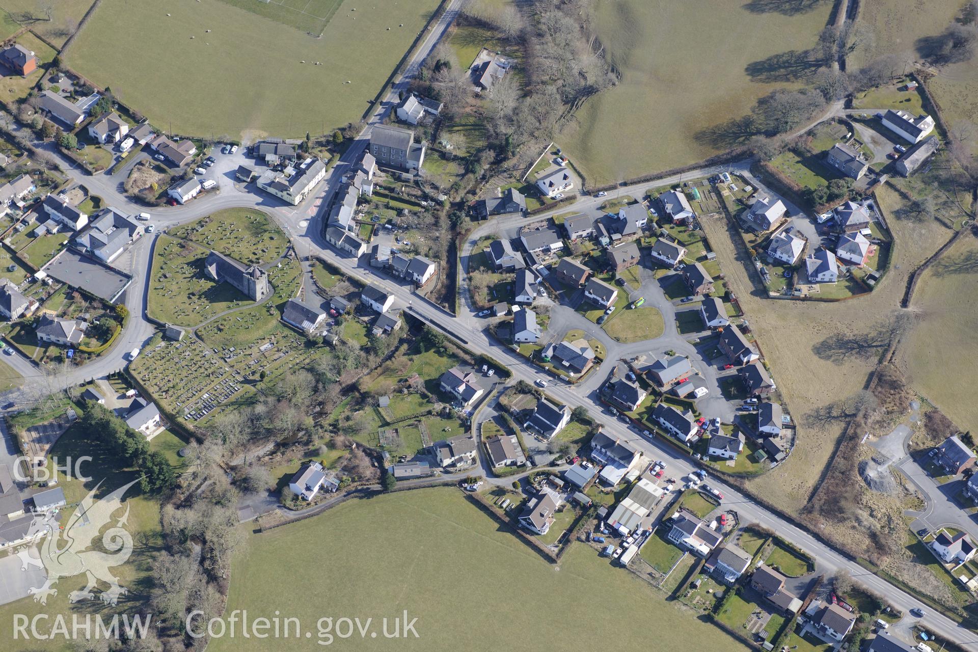 The village of Llanilar, south east of Aberystwyth, with St. Hilary's church at it's centre. Oblique aerial photograph taken during the Royal Commission?s programme of archaeological aerial reconnaissance by Toby Driver on 2nd April 2013.