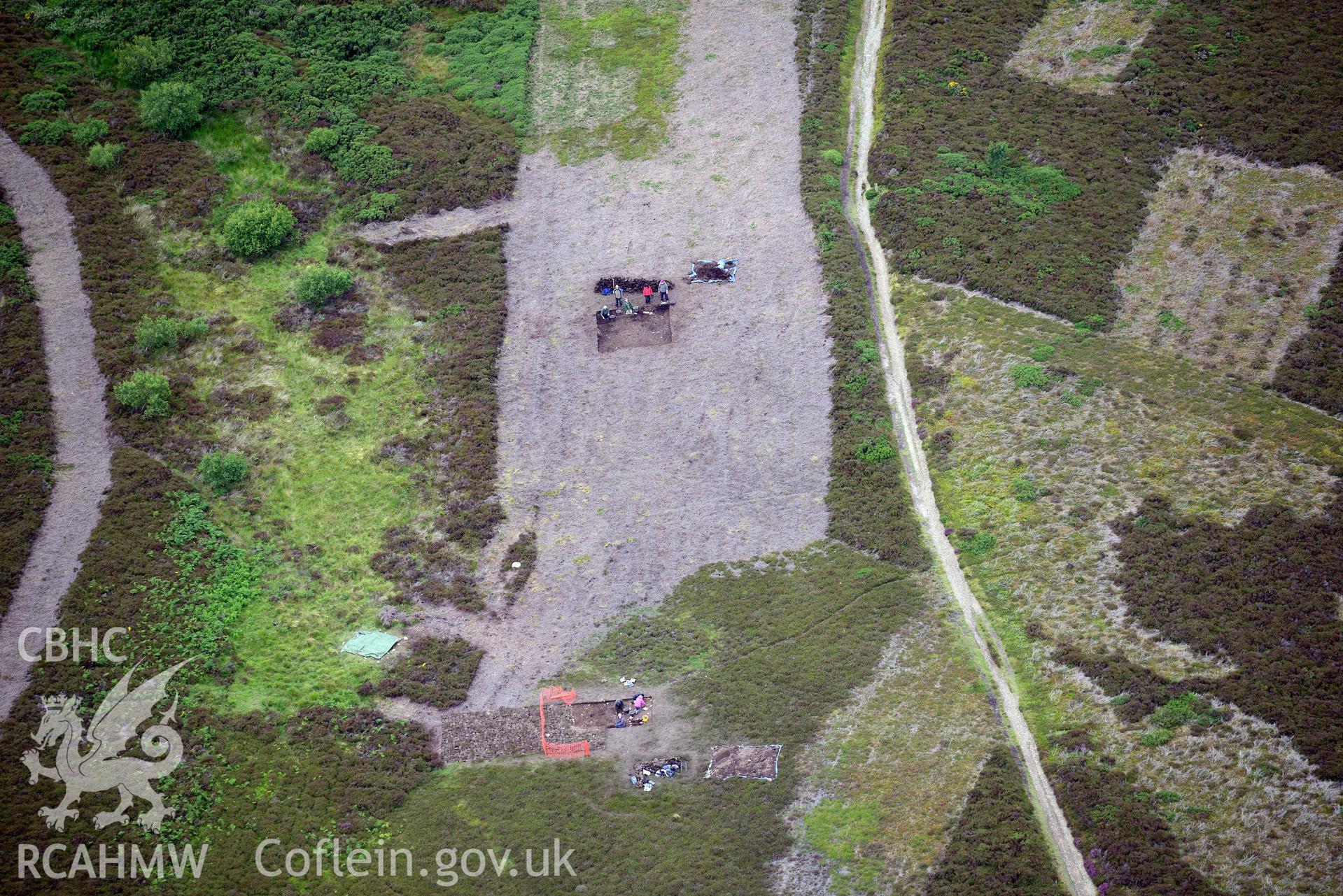 Moel Arthur Hillfort. Excavation by Liverpool University. Oblique aerial photograph taken during the Royal Commission's programme of archaeological aerial reconnaissance by Toby Driver on 30th July 2015.