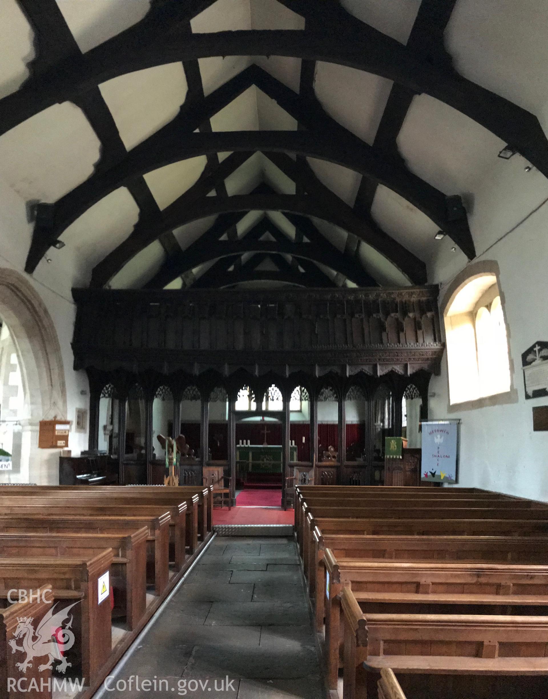 Colour photo showing interior of St. Grwst's Church, Llanrwst, including wooden beams and rood screen taken by Paul R. Davis, 23rd June 2018.