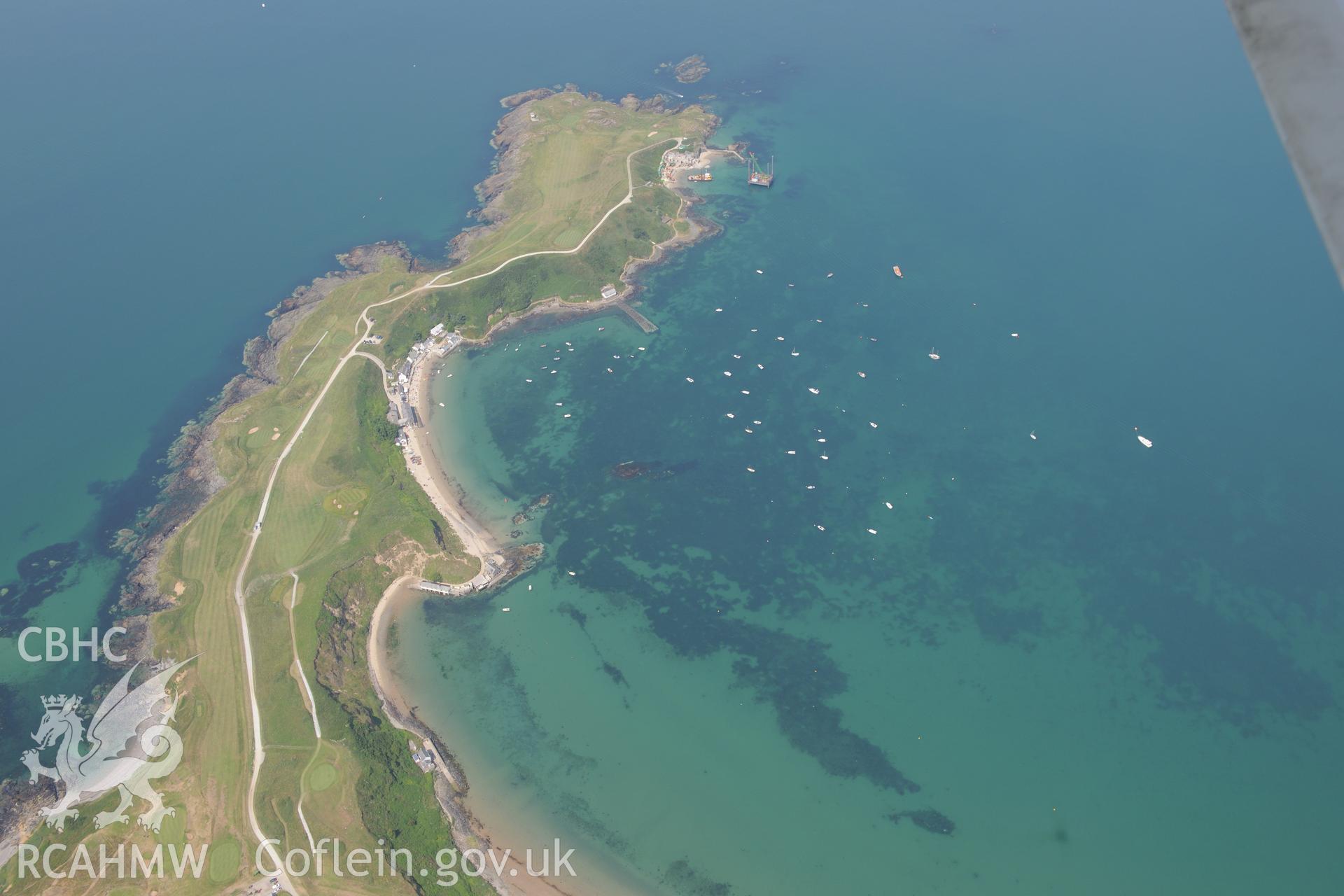 Lifeboat House, Lighthouse, Old Pier, Trwyn Porth Dinllaen Promontory Enclosure and Porth Dinllaen village. Oblique aerial photograph taken during the Royal Commission?s programme of archaeological aerial reconnaissance by Toby Driver on 12th July 2013.