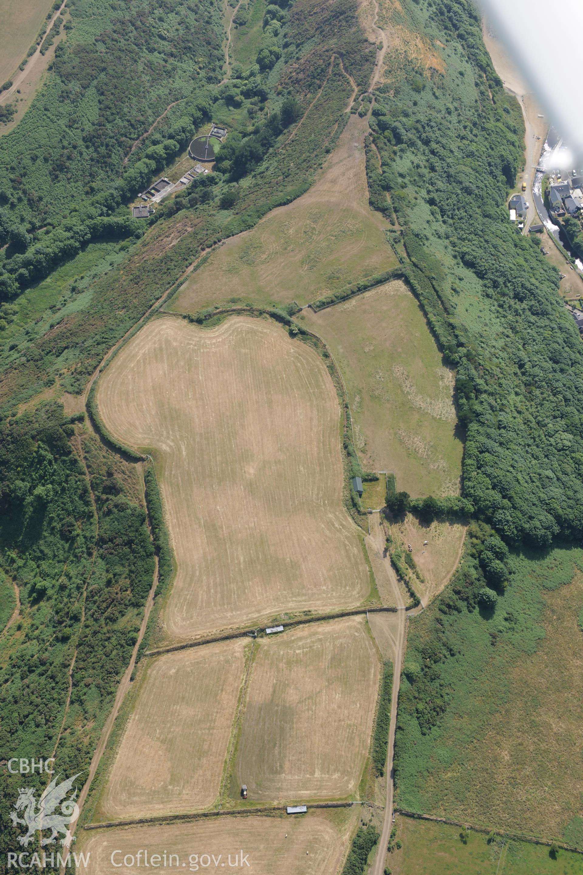 Defended enclosure at Solva. Oblique aerial photograph taken during the Royal Commission?s programme of archaeological aerial reconnaissance by Toby Driver on 16th July 2013.