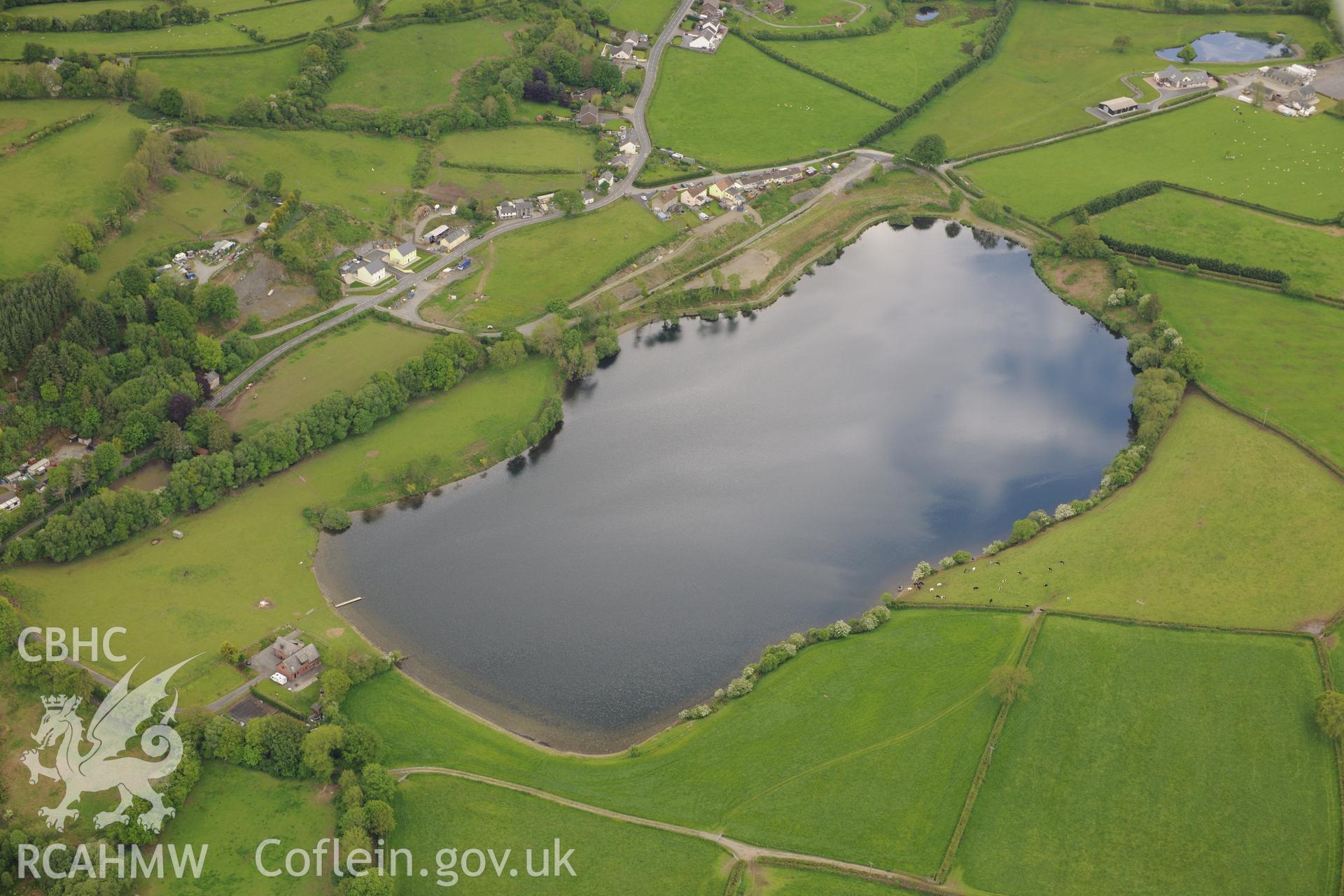 Roman mace find and railway halt at Llyn Pencarreg. Oblique aerial photograph taken during the Royal Commission's programme of archaeological aerial reconnaissance by Toby Driver on 3rd June 2015.