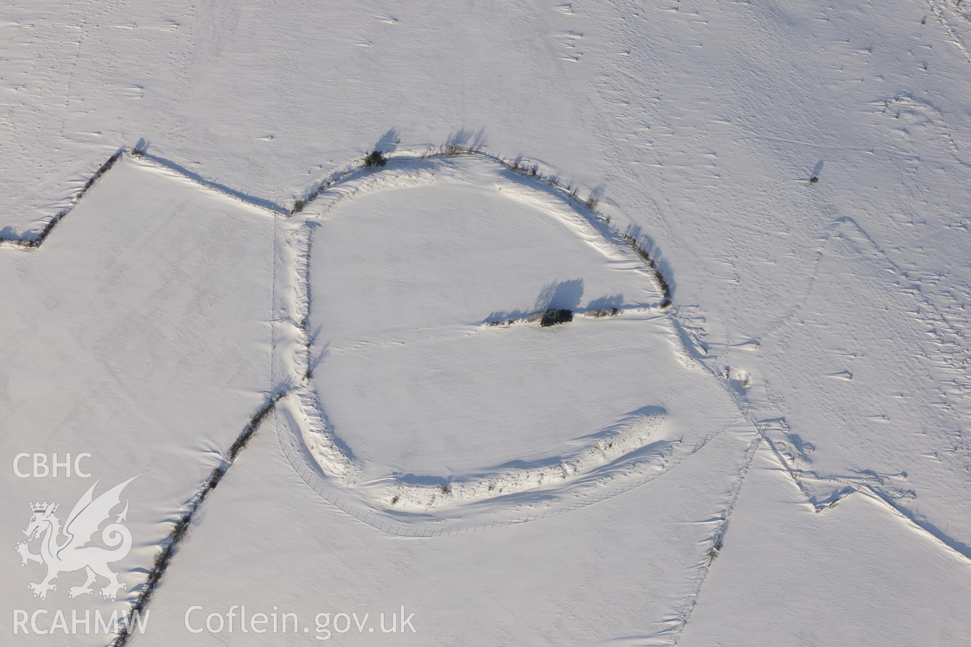 Coedcae Gaer hillfort, north east of Bridgend. Oblique aerial photograph taken during the Royal Commission?s programme of archaeological aerial reconnaissance by Toby Driver on 24th January 2013.