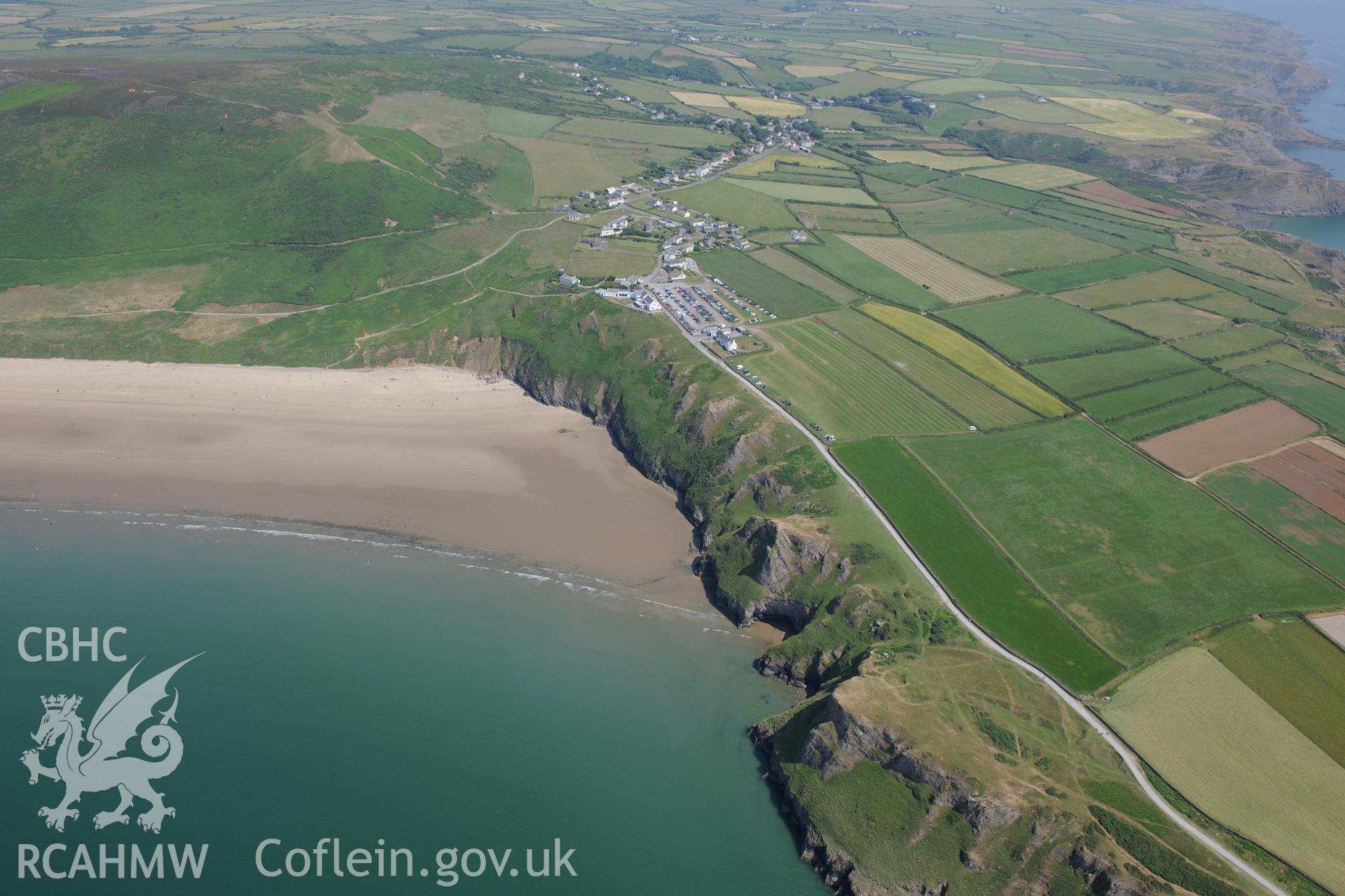 Old Castle Promontory Fort, and Rhossili Bay. Oblique aerial photograph taken during the Royal Commission?s programme of archaeological aerial reconnaissance by Toby Driver on 16th July 2013.