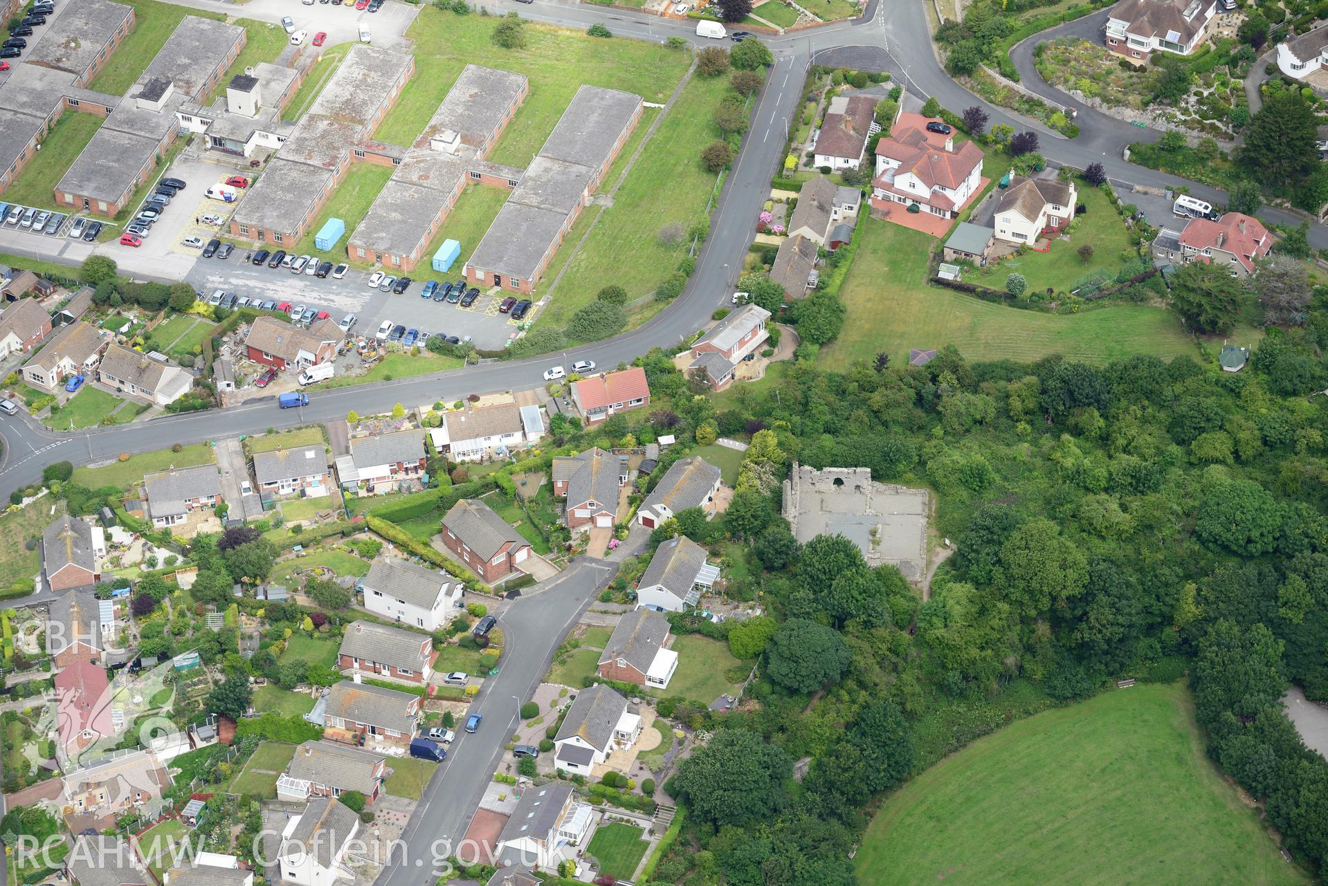 Rhos-on-Sea and the remains of Llys Euryn. Oblique aerial photograph taken during the Royal Commission's programme of archaeological aerial reconnaissance by Toby Driver on 30th July 2015.