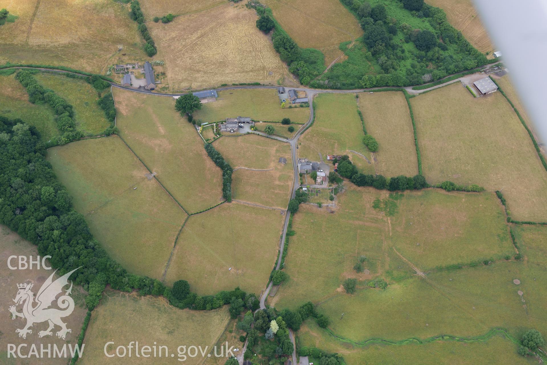 Royal Commission aerial photography of extensive parchmarks at Pen y Gaer Roman fort, including the internal plan and extramural buildings, taken on 19th July 2018 during the 2018 drought.