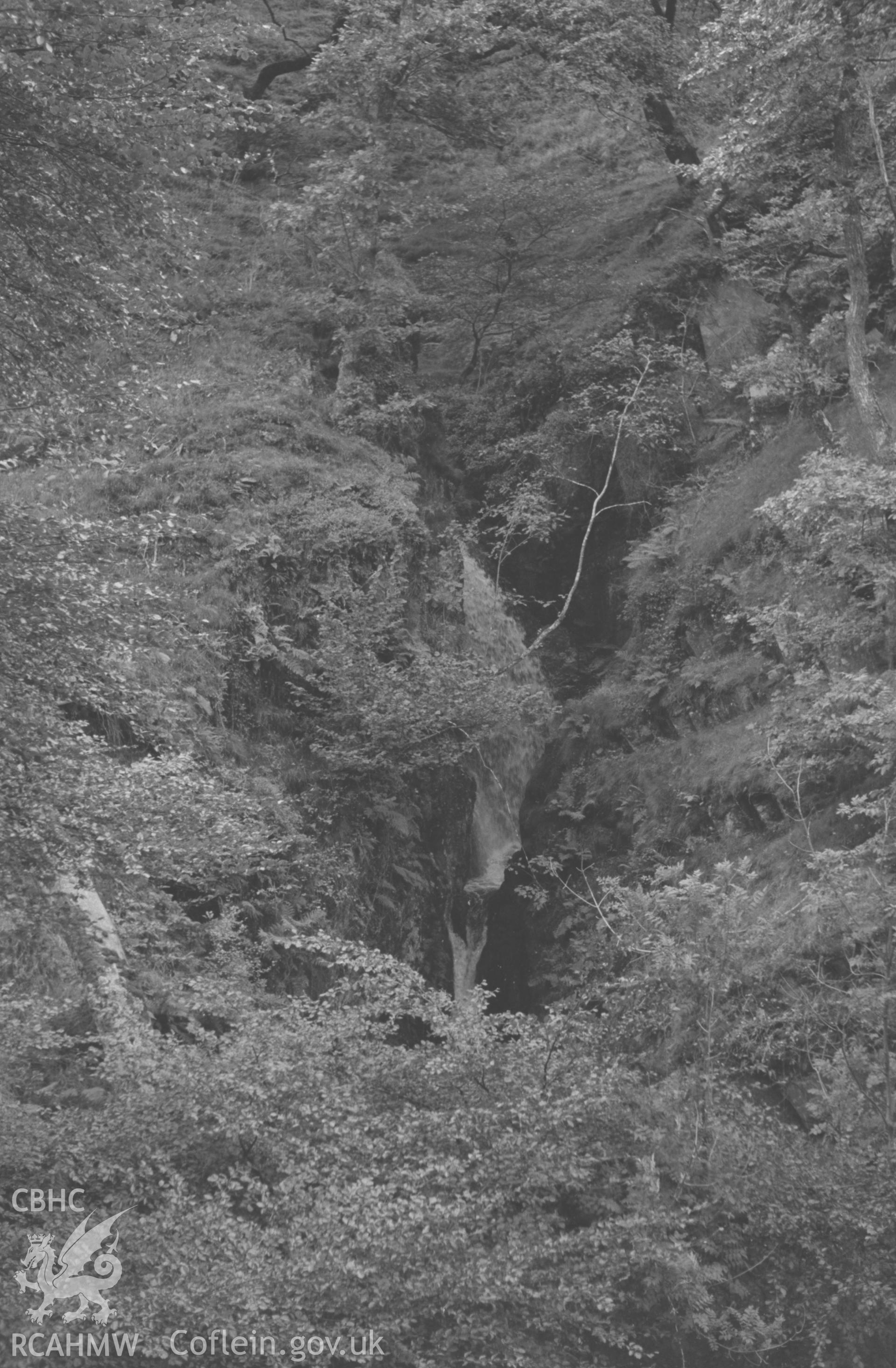 Digital copy of a black and white negative showing The Cavern Waterfall (Robber's Cave) on Nant Gau, at Hafod. Photographed by Arthur O. Chater in September 1964 from Grid Reference SN 7752 7271, looking west.