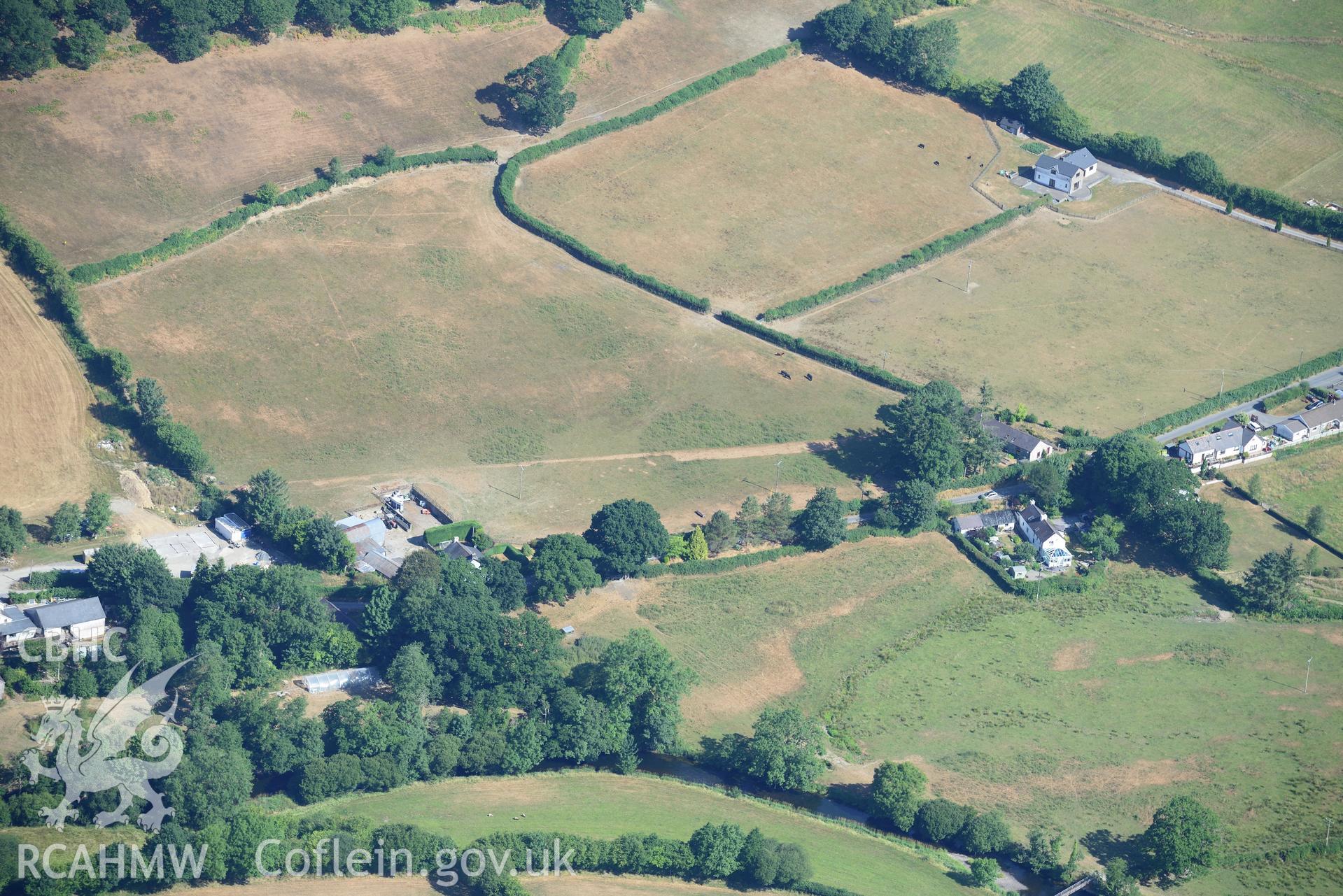 Royal Commission aerial photography of parchmarks of the Roman road approaching Llanfair Clydogau, taken on 19th July 2018 during the 2018 drought.