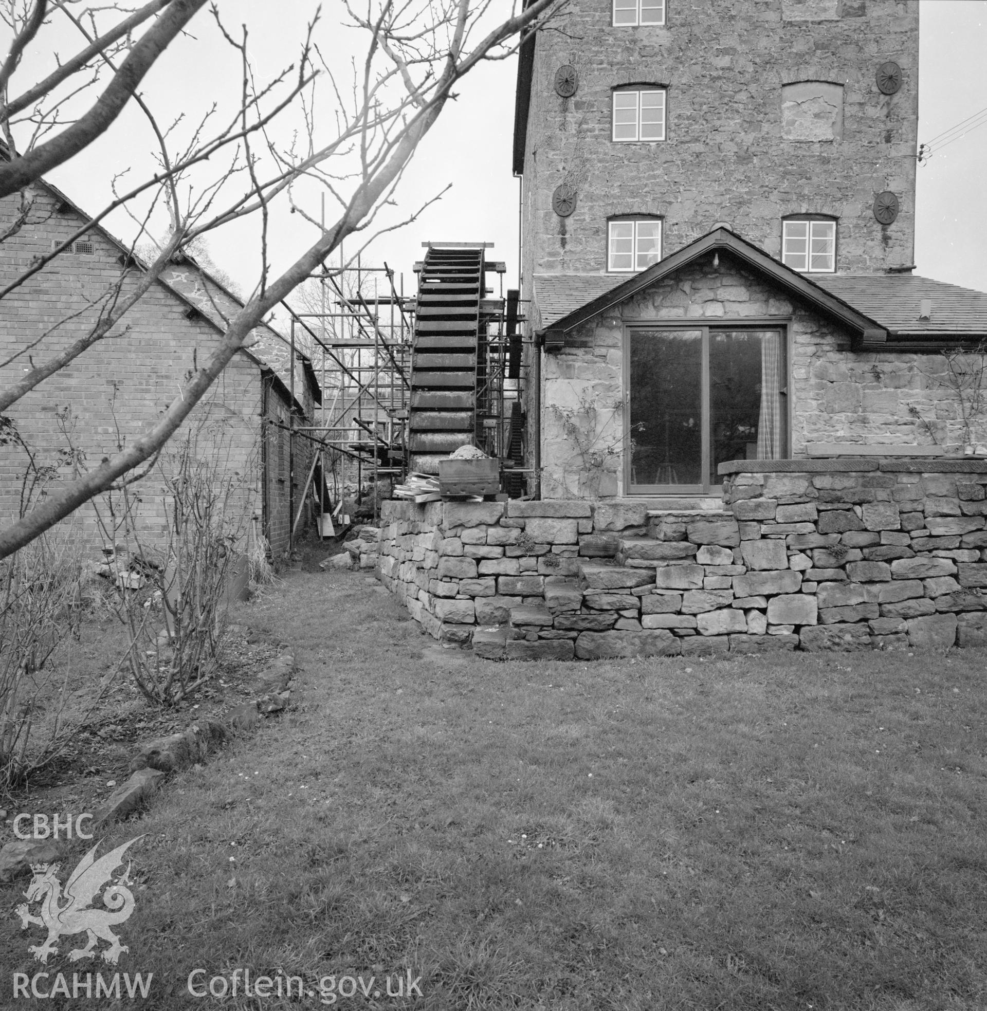 Digital copy of a black and white negative showing an exterior view of Trevor Old Mill taken by RCAHMW, 1987.