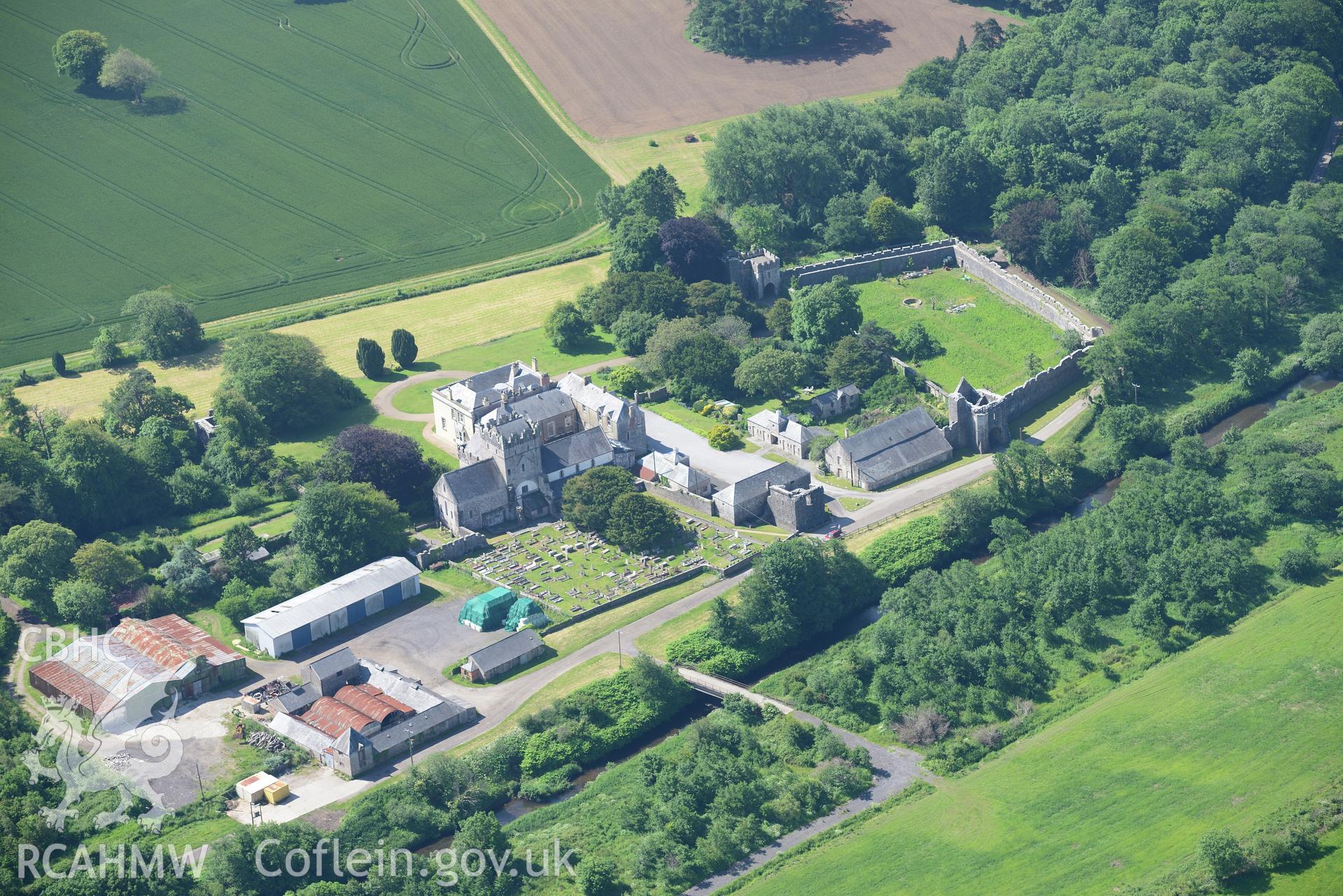 Ewenny Priory including views of the south and north gatehouses; Priory House; north tower and St. Michael's church. Oblique aerial photograph taken during the Royal Commission's programme of archaeological aerial reconnaissance by Toby Driver on 19th June 2015.